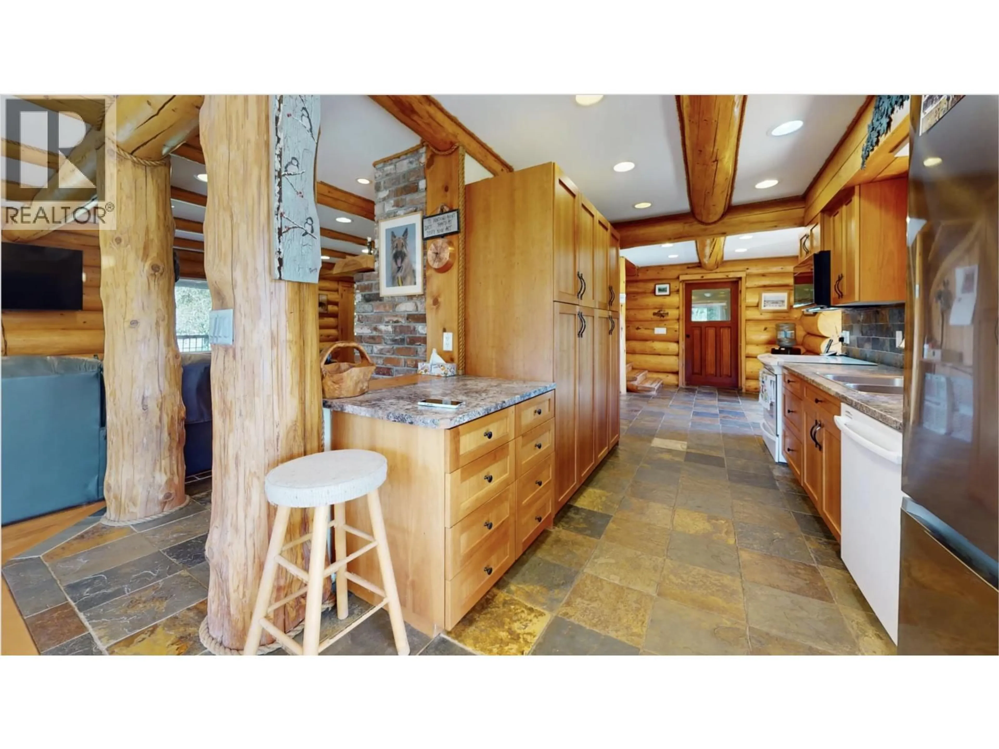 Rustic kitchen, ceramic/tile floor for 4485 TRIP ROAD, 100 Mile House British Columbia V0K1M0