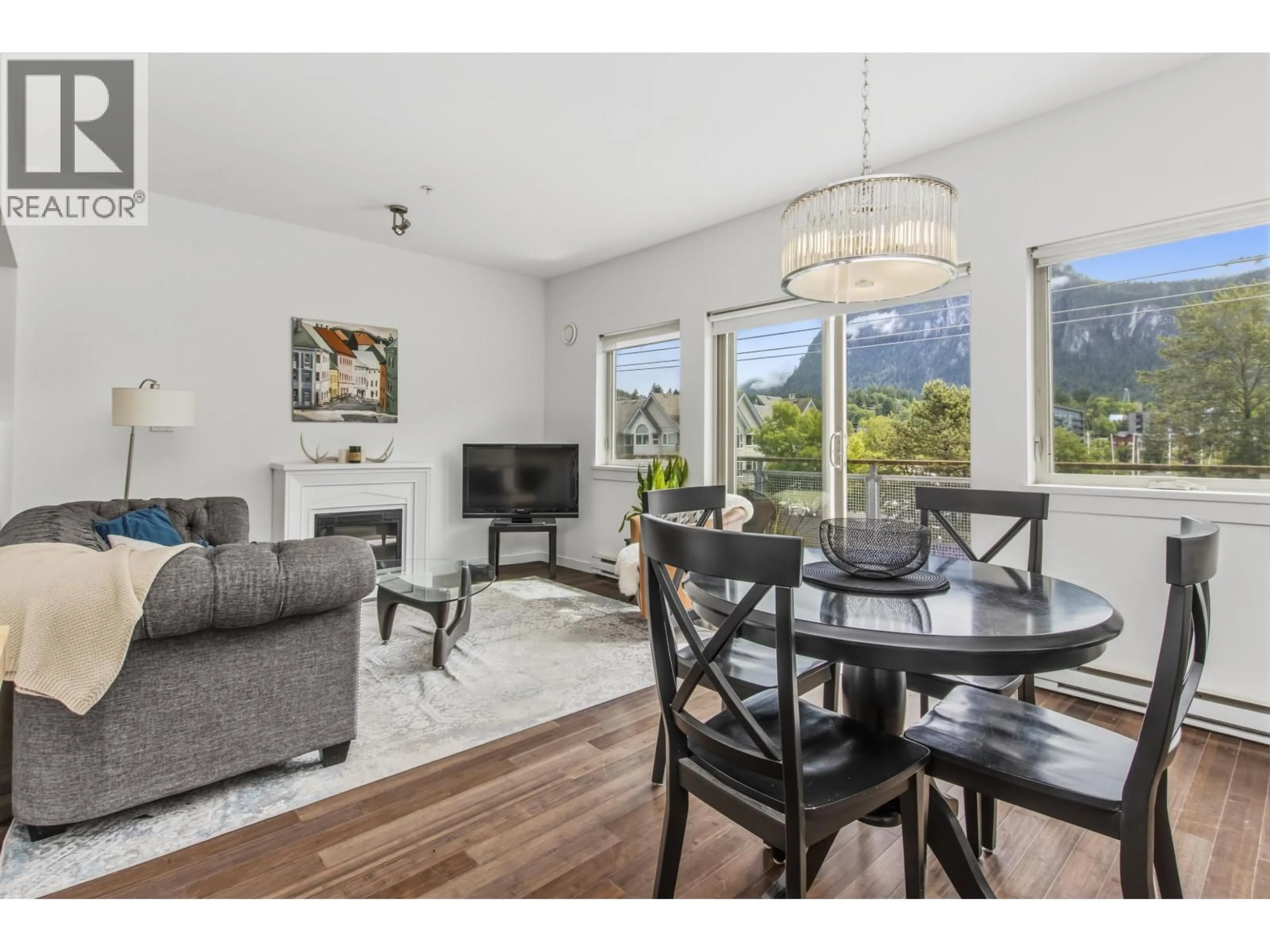 Living room with furniture, wood/laminate floor for 306 - 38142 CLEVELAND AVENUE, Squamish British Columbia V8B0A4