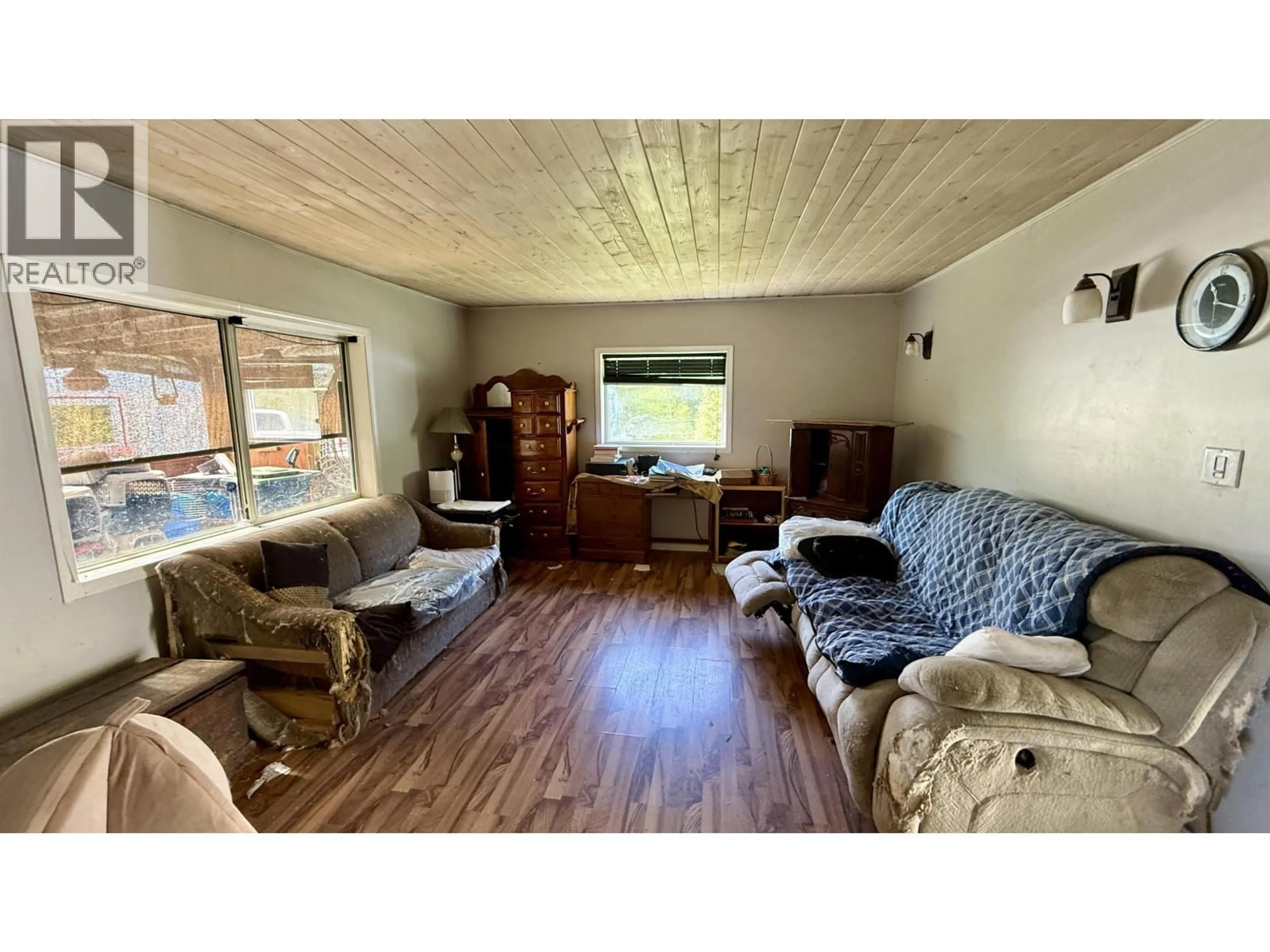 Living room with furniture, wood/laminate floor for 7573 RESORT ROAD, Canim Lake British Columbia V0K1J0