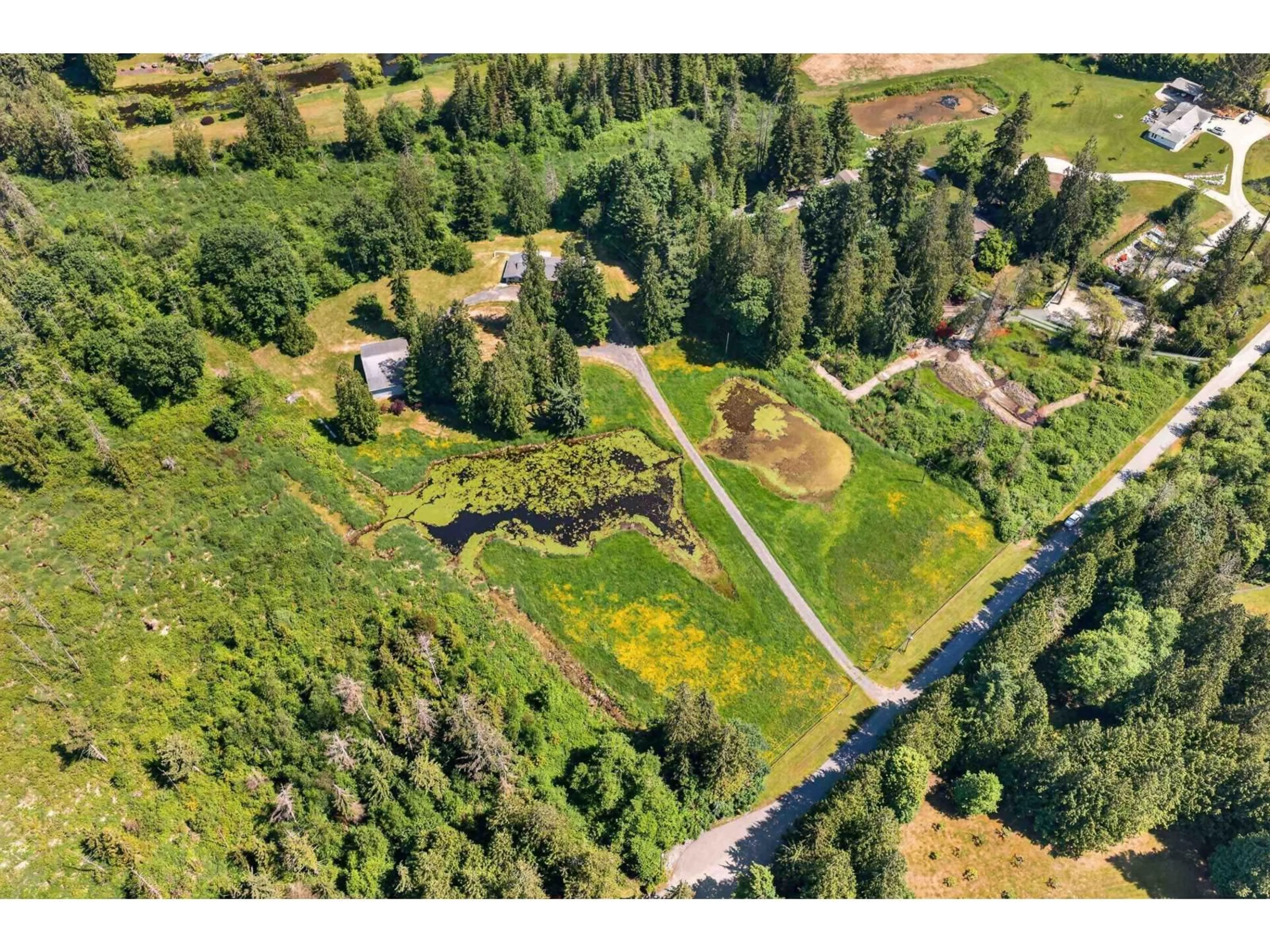 A pic from outside/outdoor area/front of a property/back of a property/a pic from drone, unknown for 22065 102 AVENUE, Langley British Columbia V1M3V3