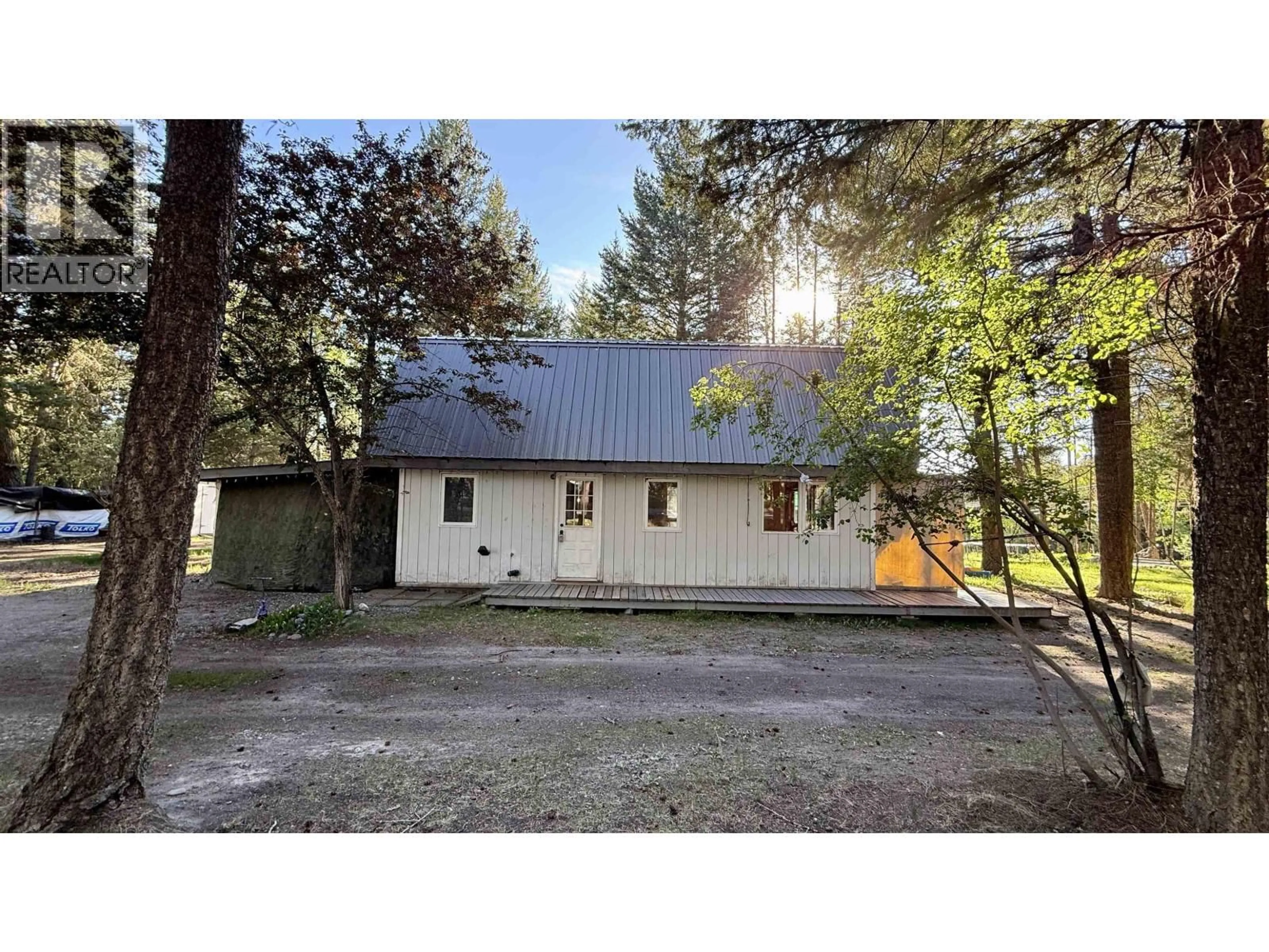 A pic from outside/outdoor area/front of a property/back of a property/a pic from drone, street for 4834 GLOINNZUN DRIVE, 108 Mile Ranch British Columbia V0K2Z0