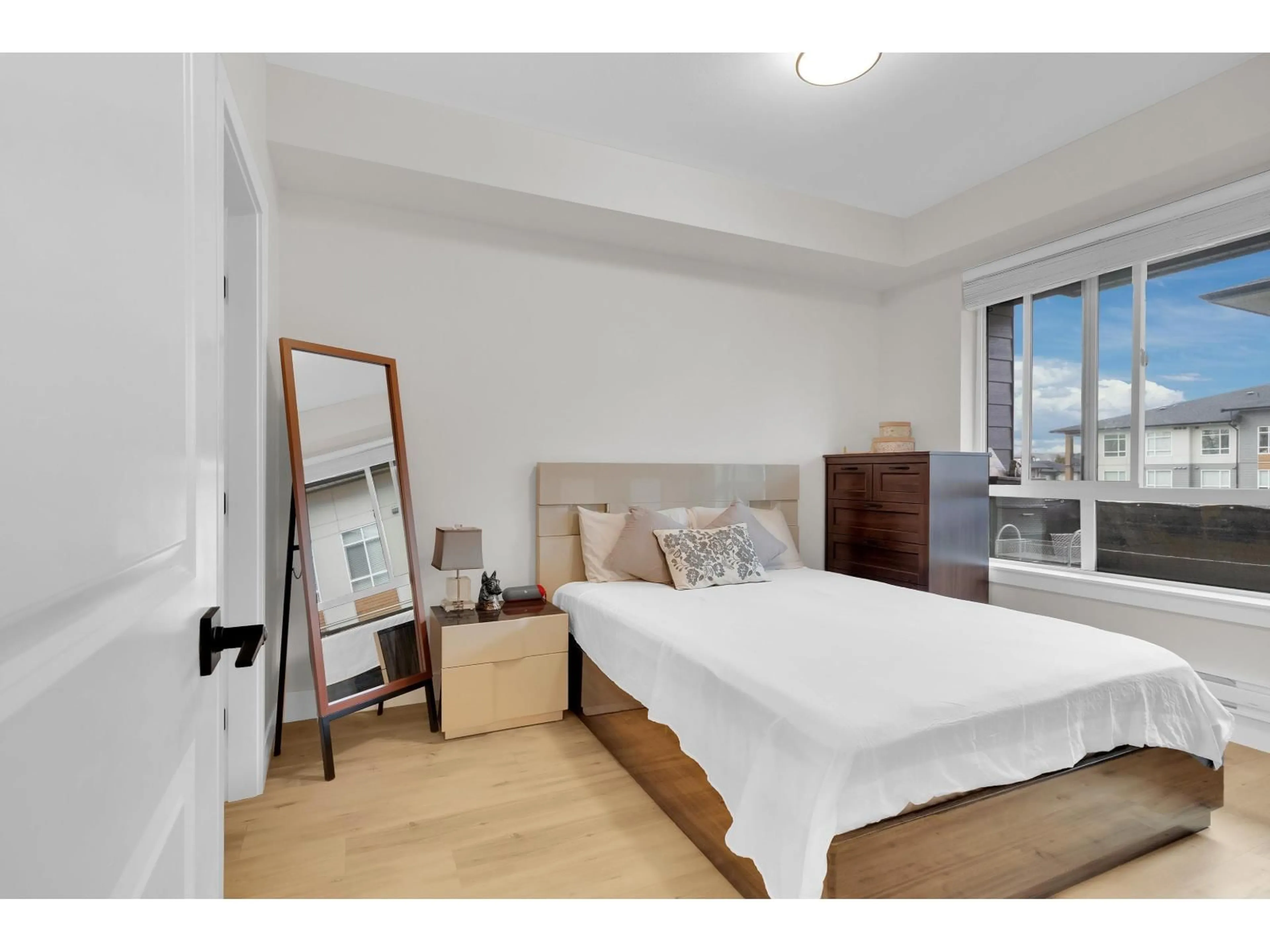 Bedroom with bed, wood/laminate floor for 320 - 7506 199A STREET, Langley British Columbia V2Y3K9