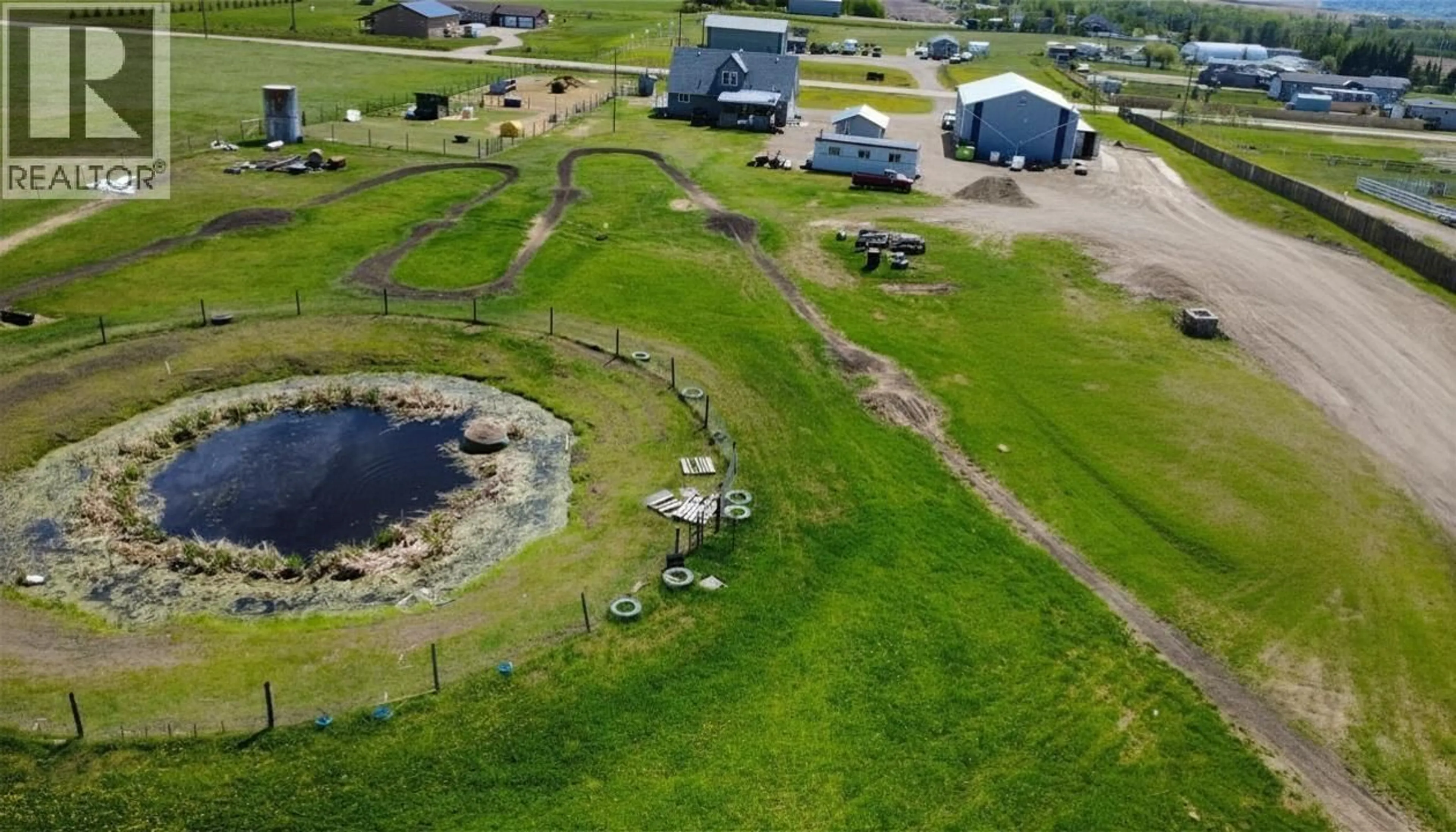 A pic from outside/outdoor area/front of a property/back of a property/a pic from drone, water/lake/river/ocean view for 8283 269 ROAD, Fort St. John British Columbia V1J8A4
