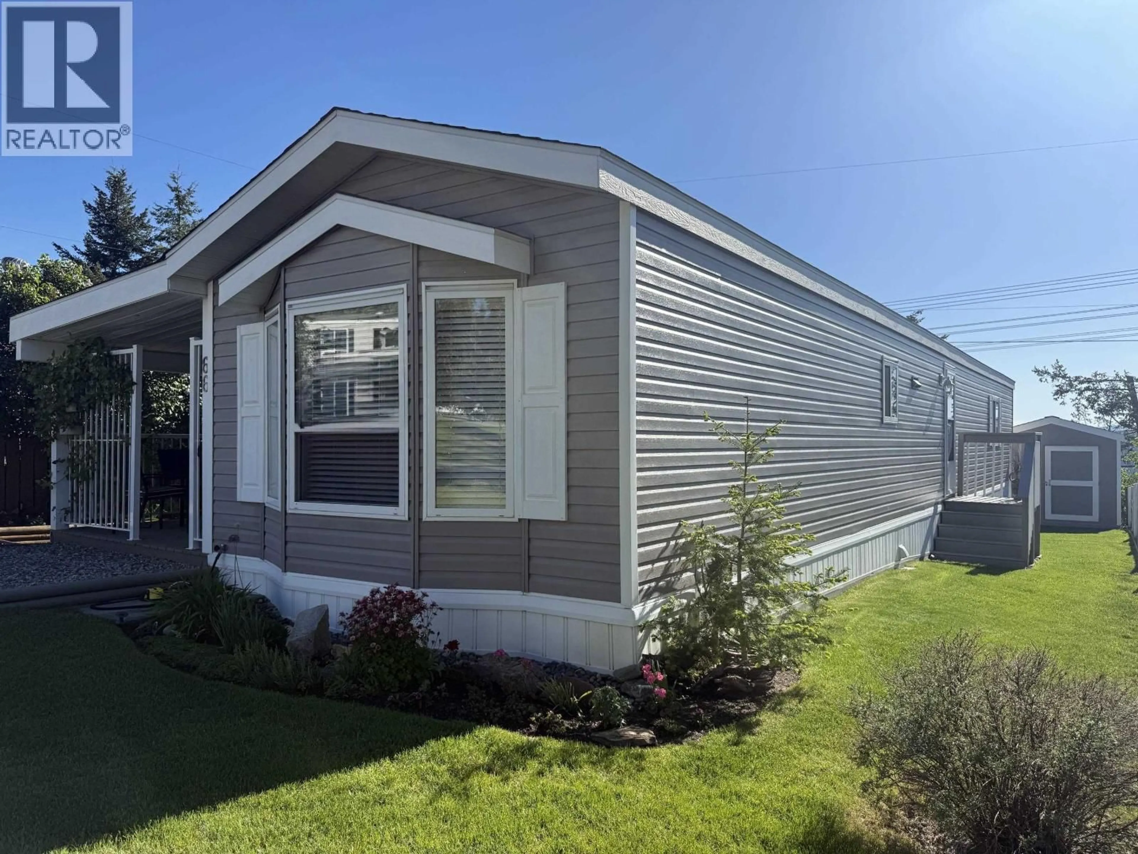 Home with vinyl exterior material, street for 66 - 997 CHILCOTIN HY 20 HIGHWAY, Williams Lake British Columbia V2G4X7