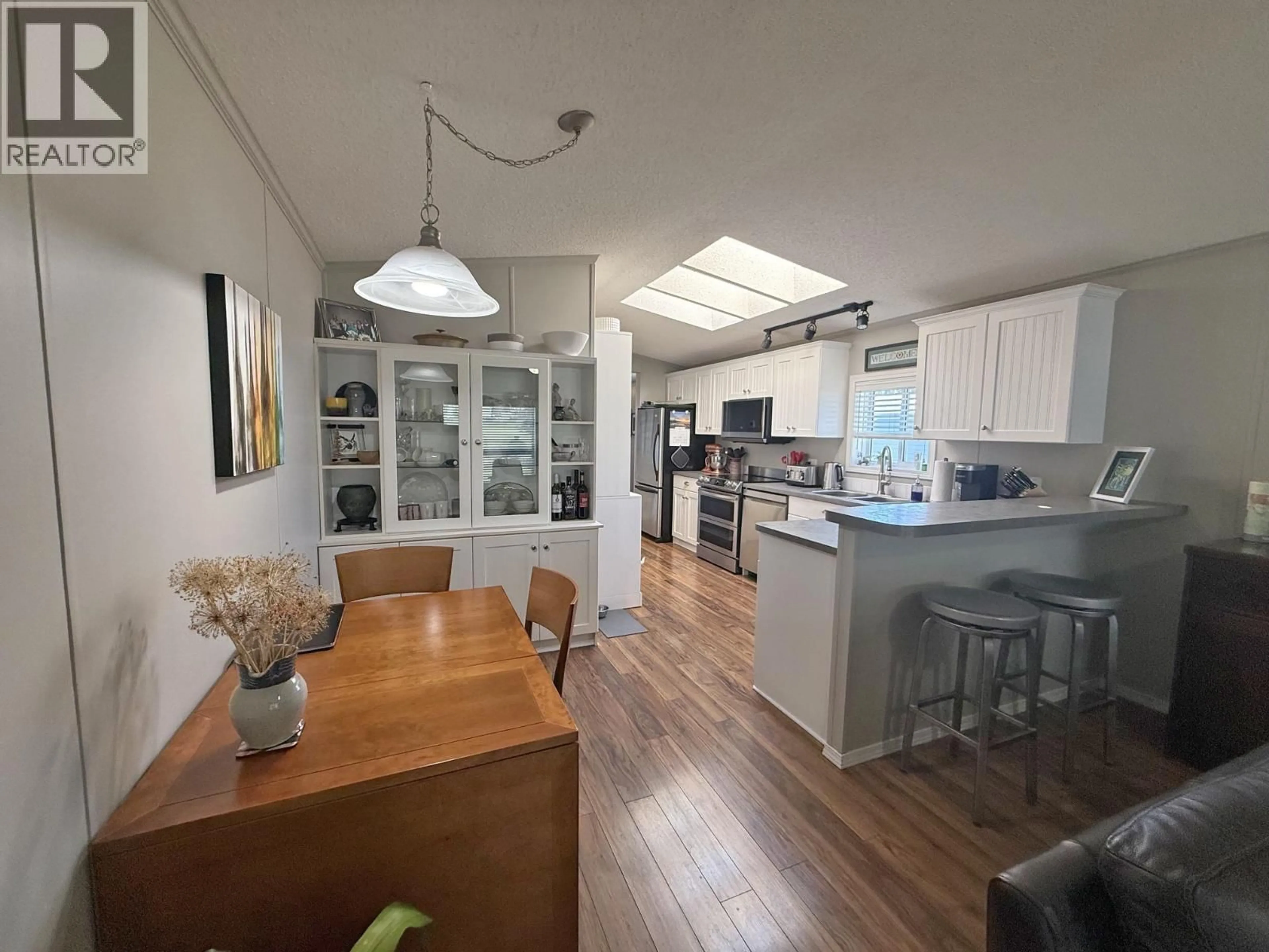 Open concept kitchen, wood/laminate floor for 66 - 997 CHILCOTIN HY 20 HIGHWAY, Williams Lake British Columbia V2G4X7