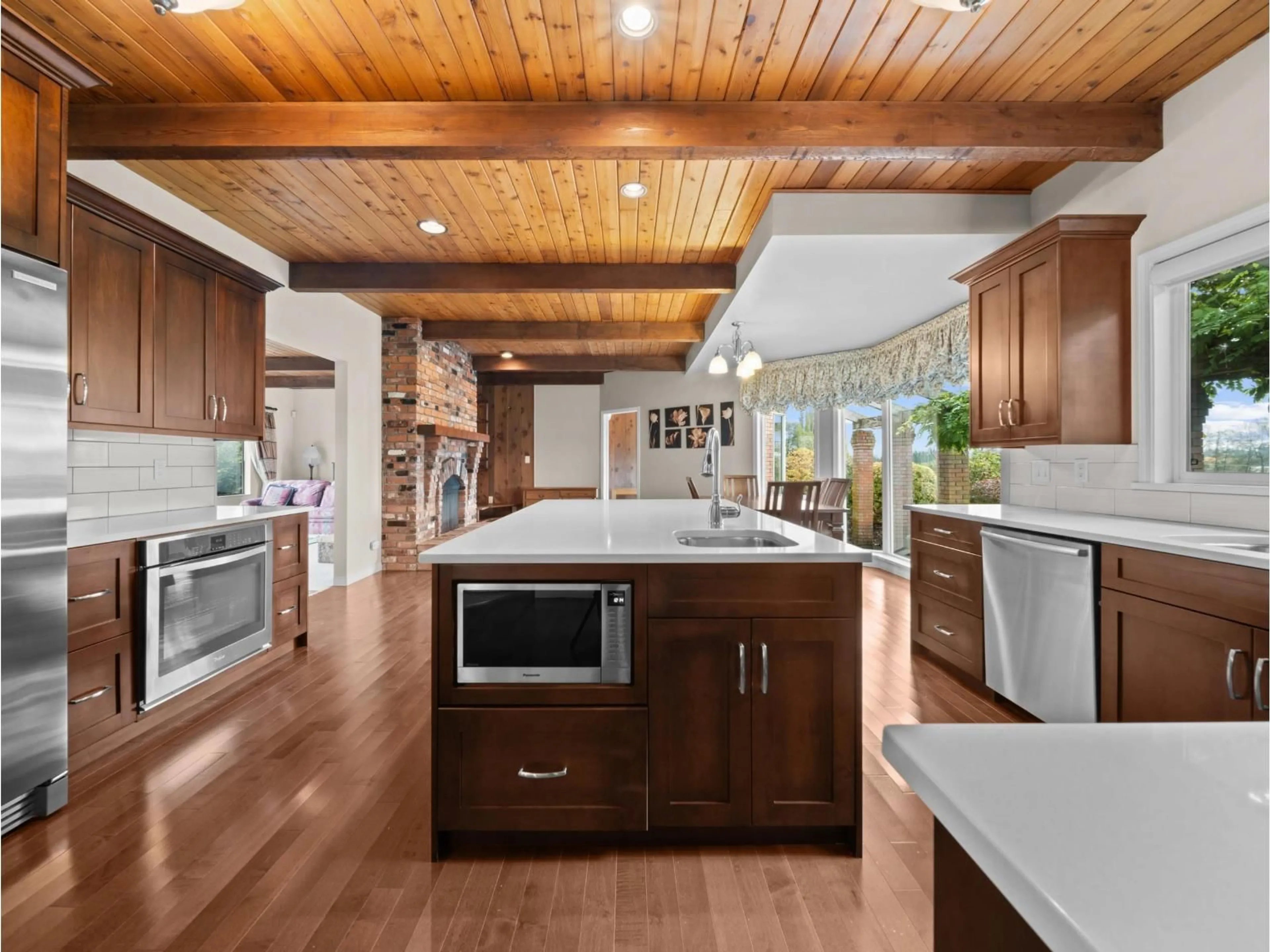 Open concept kitchen, wood/laminate floor for 22383 96 AVENUE, Langley British Columbia V1M3T6