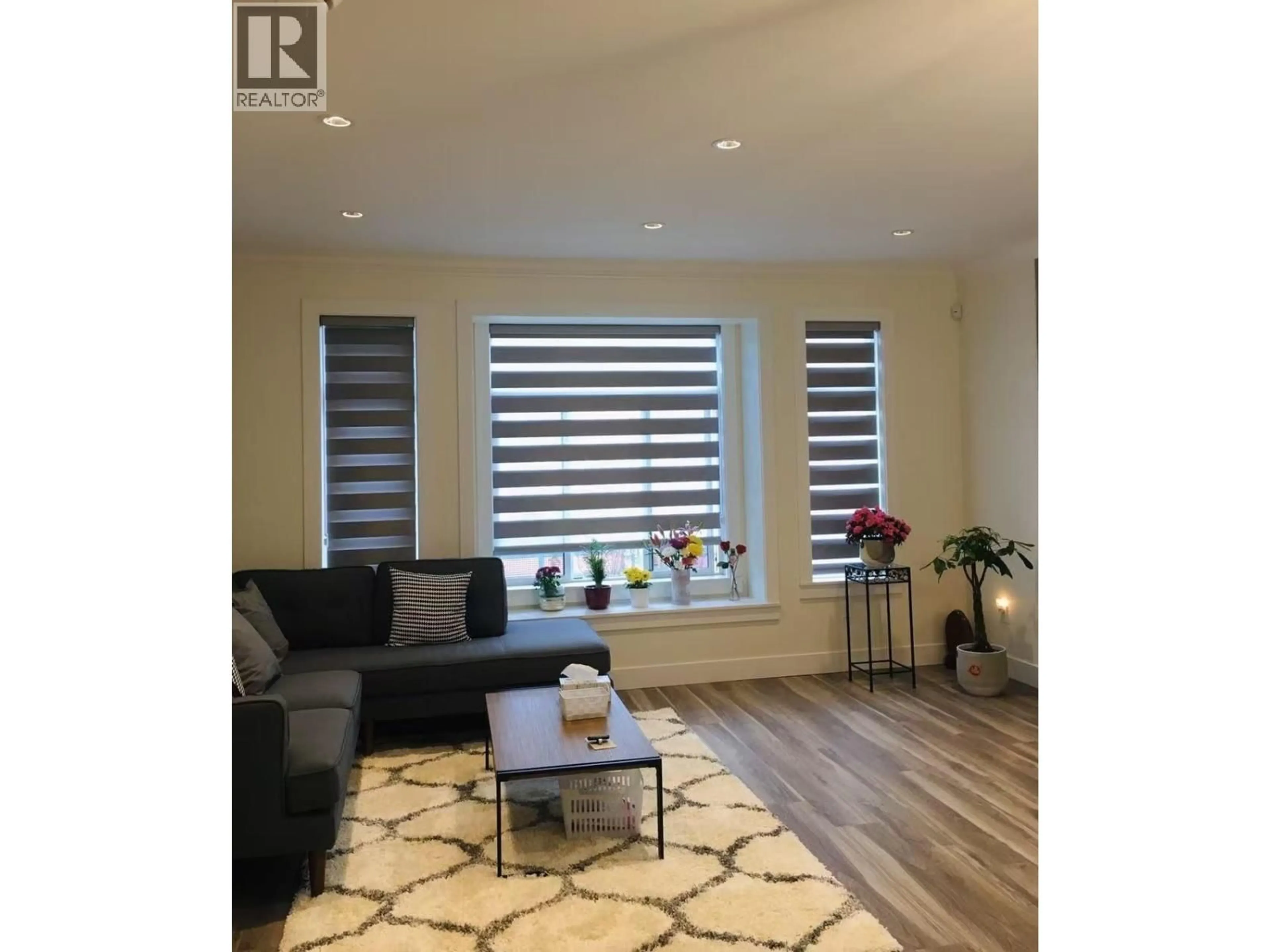 Living room with furniture, wood/laminate floor for 2822 GLEN DRIVE, Coquitlam British Columbia V3B0A4