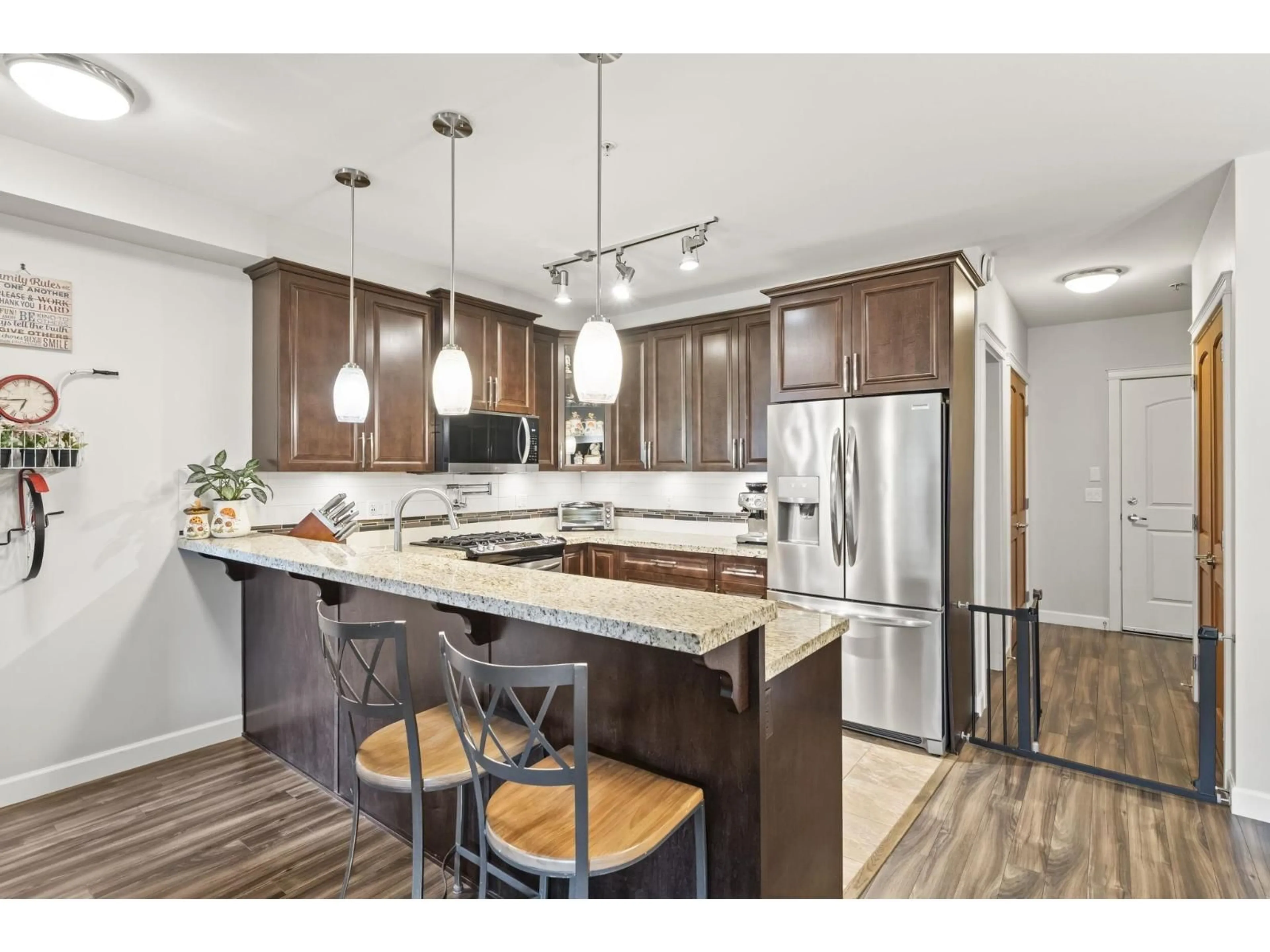 Open concept kitchen, wood/laminate floor for B411 - 8218 207A STREET, Langley British Columbia V2Y0Y1