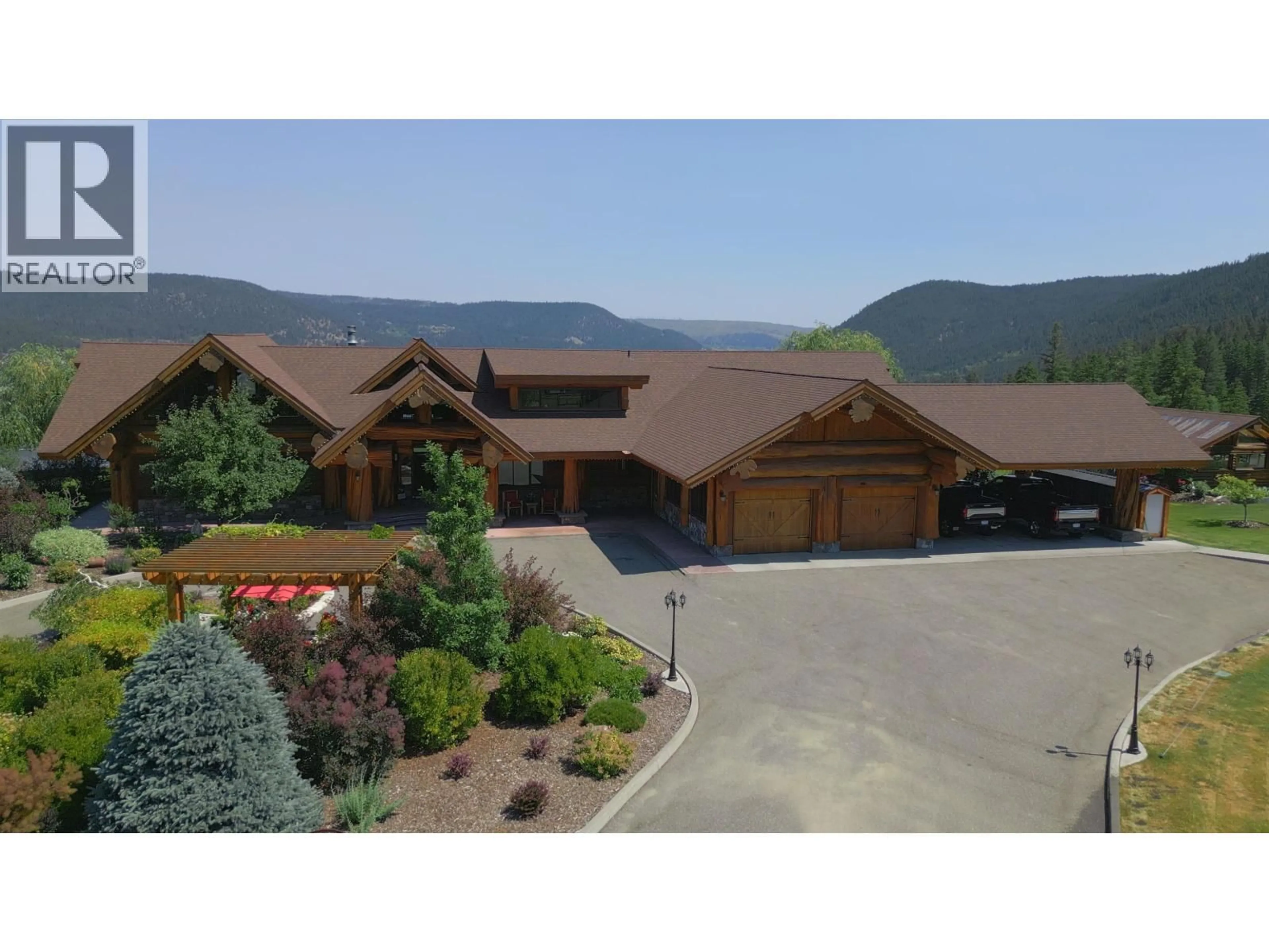 A pic from outside/outdoor area/front of a property/back of a property/a pic from drone, mountain view for 1255 PROSPERITY WAY, Williams Lake British Columbia V2G0A6
