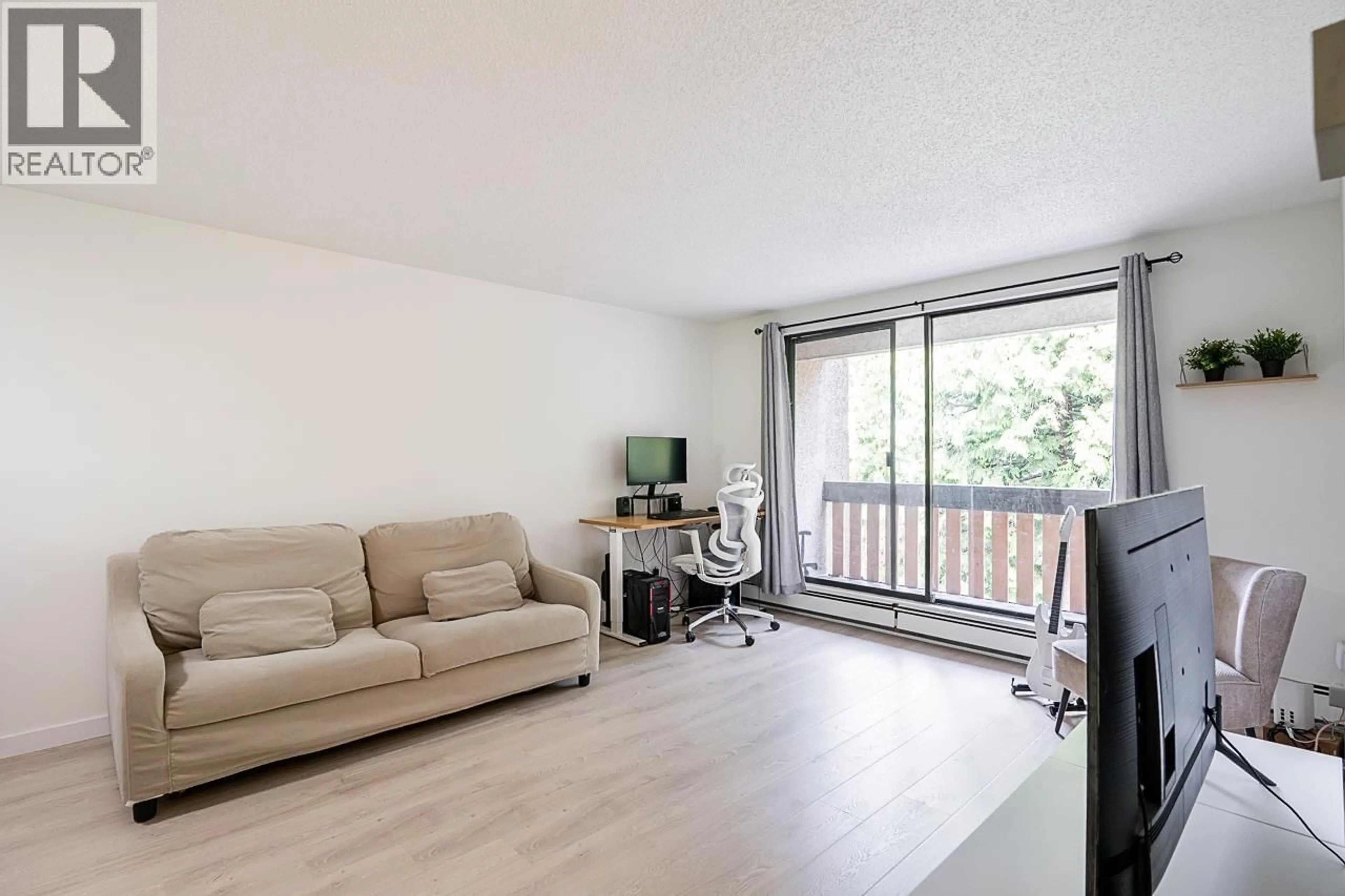 Living room with furniture, wood/laminate floor for 210 - 8640 CITATION DRIVE, Richmond British Columbia V6Y3A3