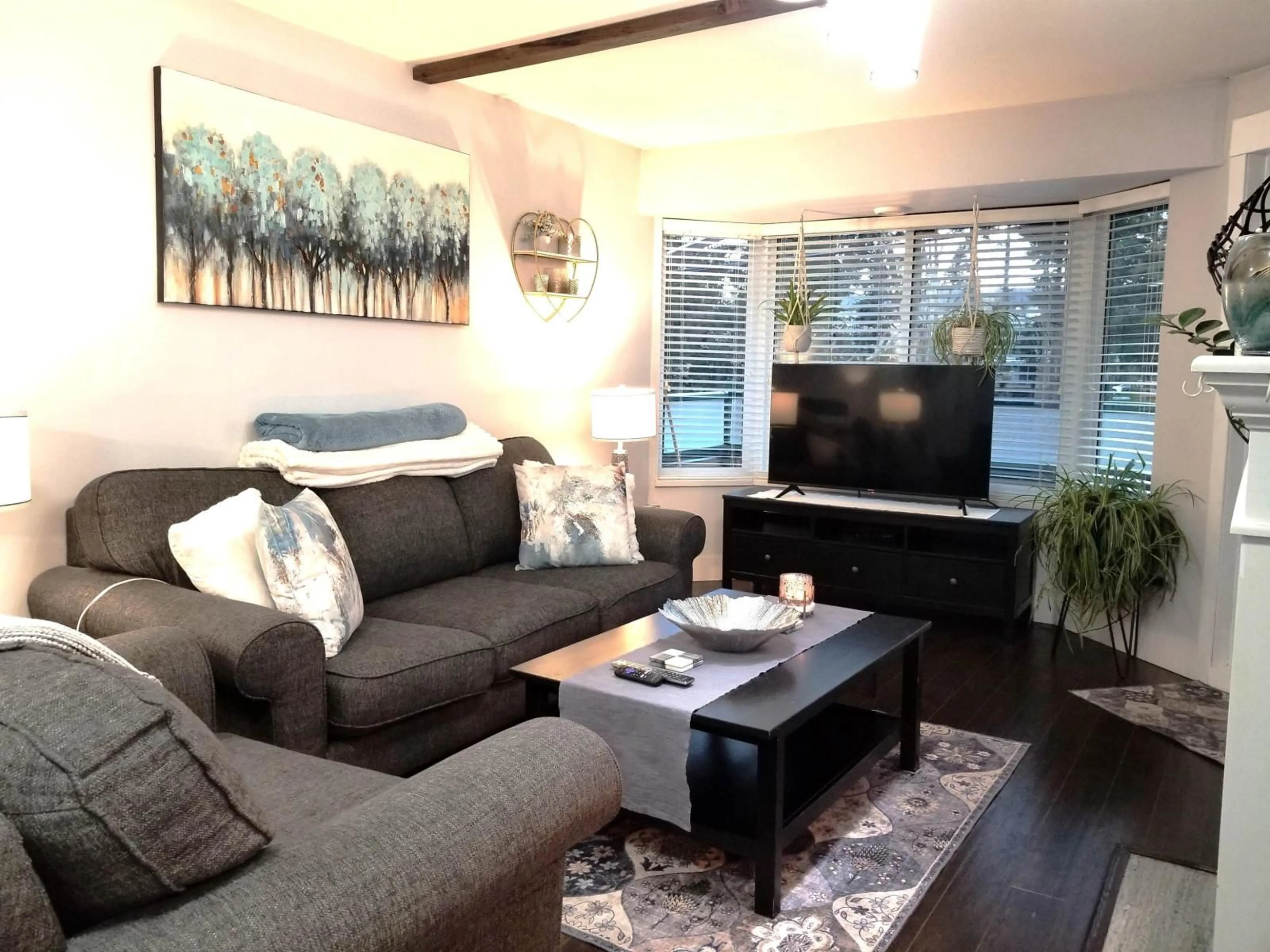 Living room with furniture, wood/laminate floor for 208 - 2964 TRETHEWEY STREET, Abbotsford British Columbia V2T6P4