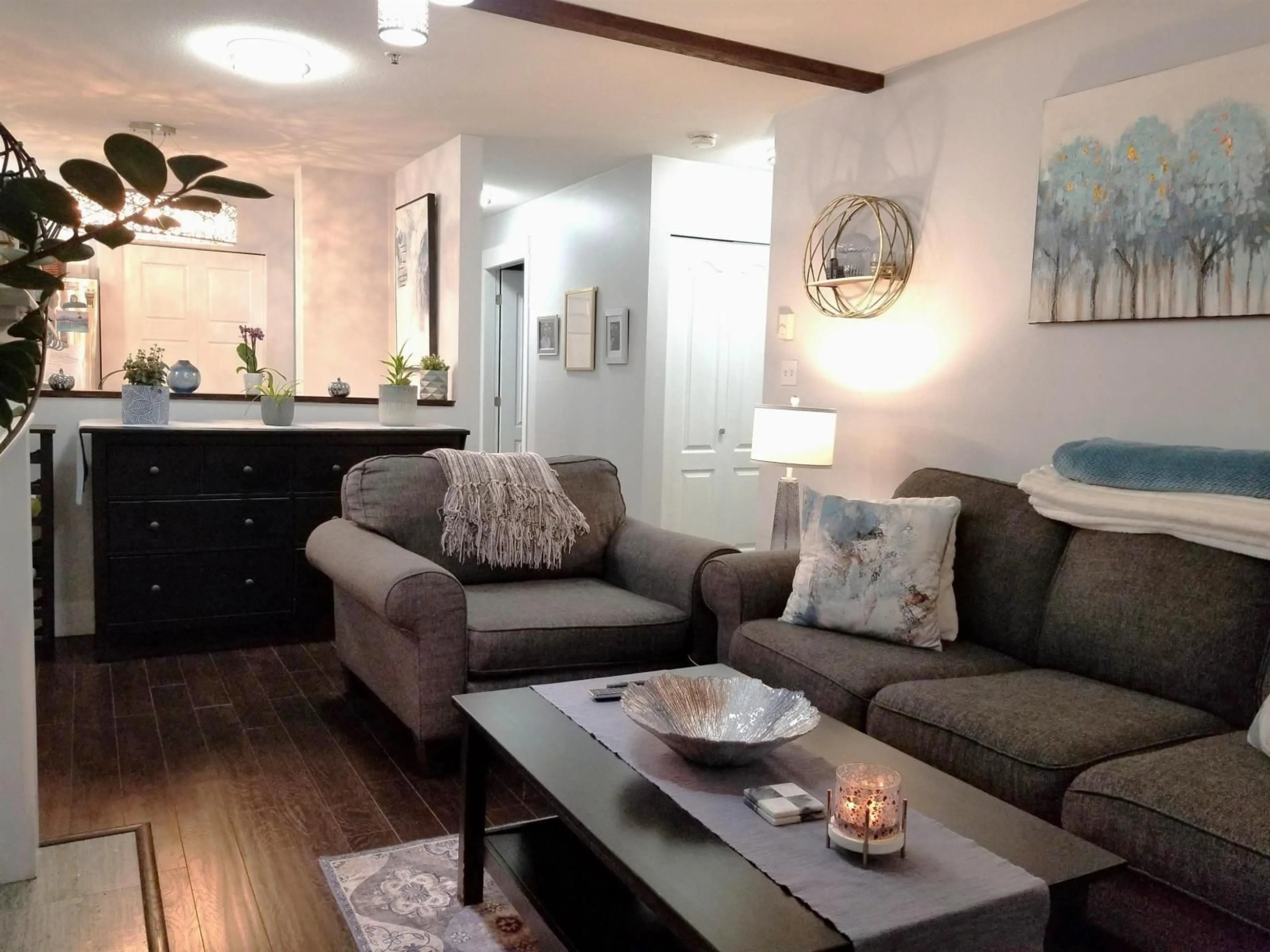 Living room with furniture, wood/laminate floor for 208 - 2964 TRETHEWEY STREET, Abbotsford British Columbia V2T6P4