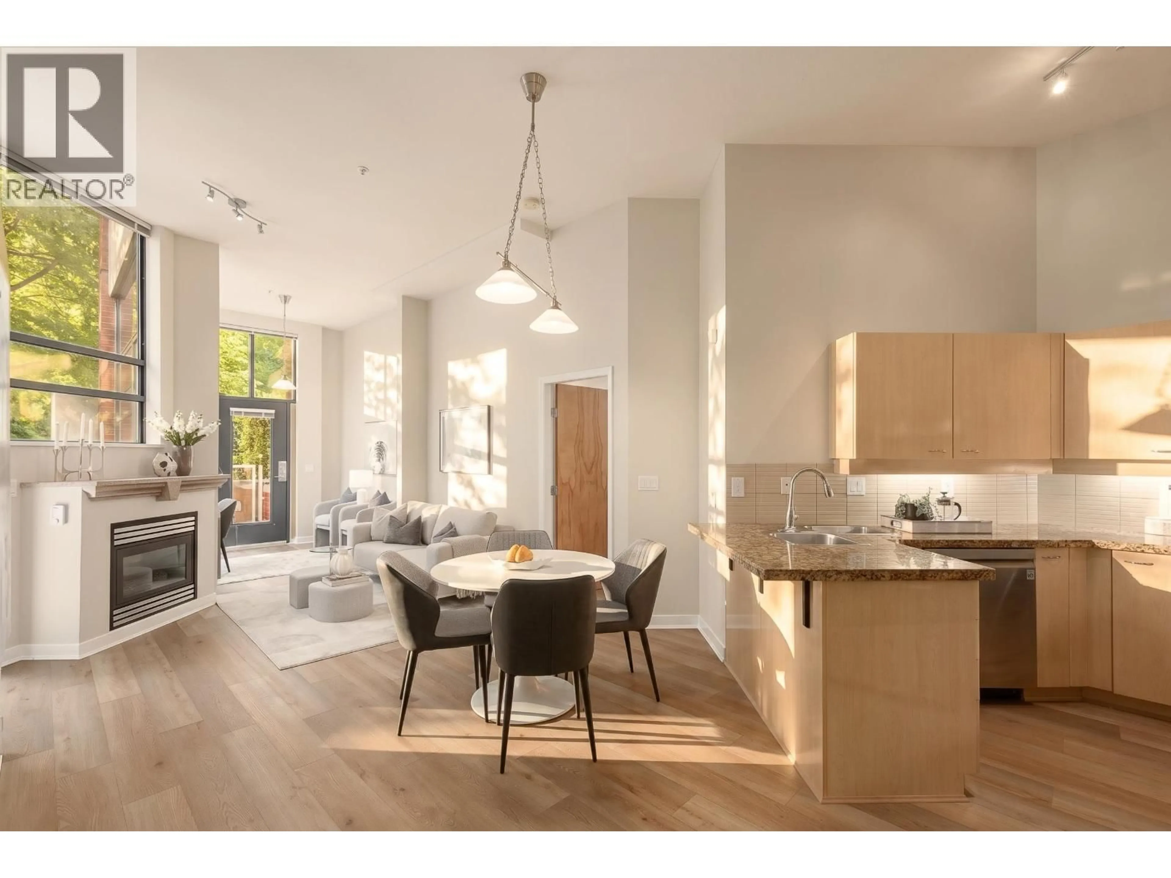 Open concept kitchen, wood/laminate floor for 102 - 2228 MARSTRAND AVENUE, Vancouver British Columbia V6K4T1