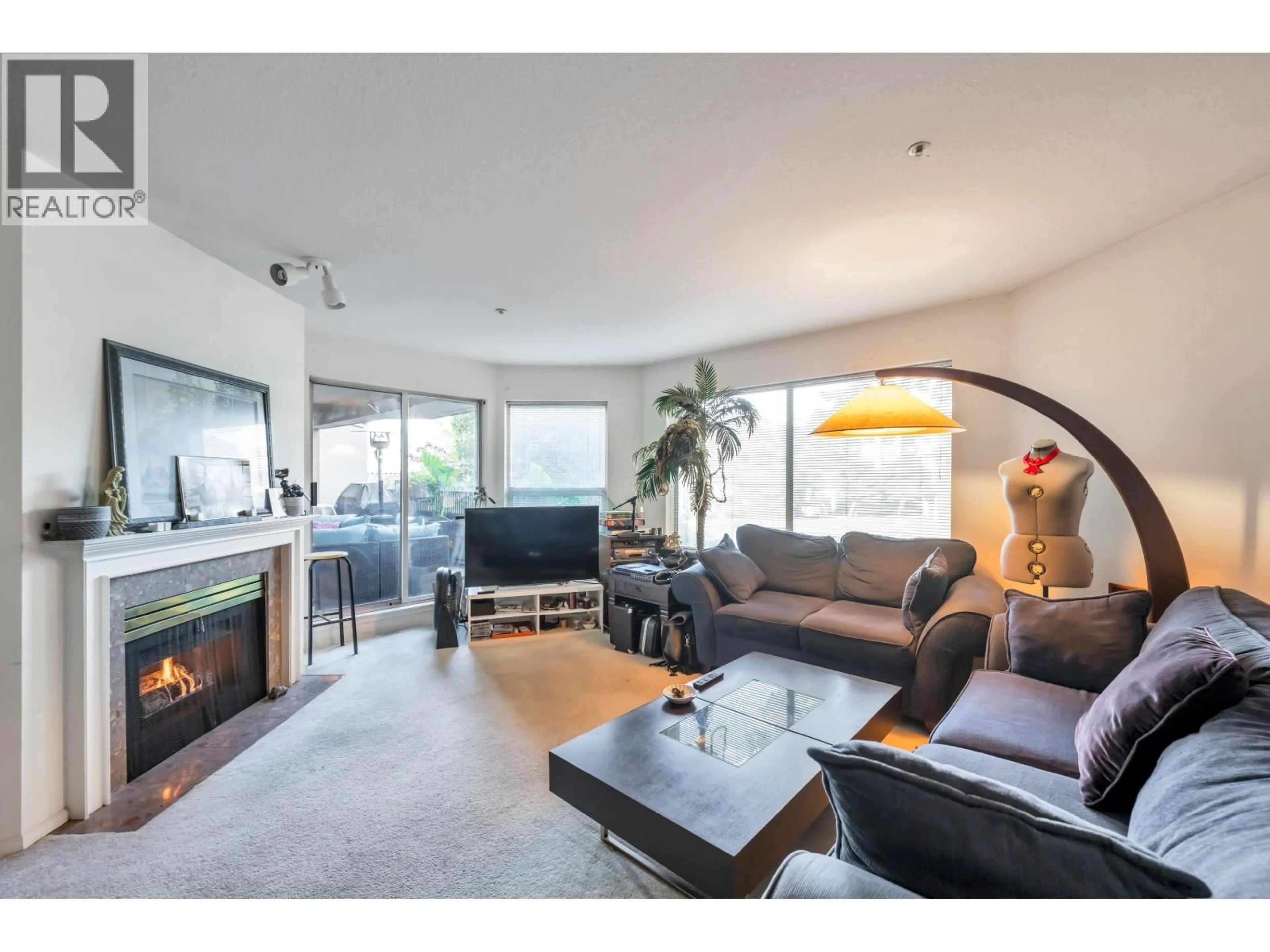 Living room with furniture, wood/laminate floor for 202 - 525 WHEELHOUSE SQUARE, Vancouver British Columbia V5Z4L8