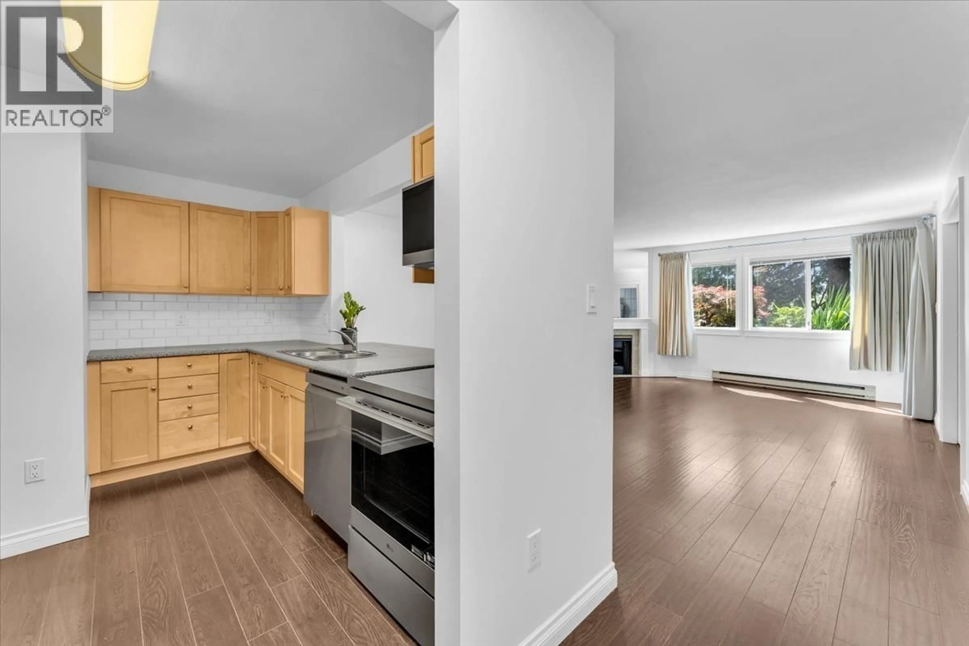 Open concept kitchen, unknown for 107 - 5350 VICTORY STREET, Burnaby British Columbia V5J1T1