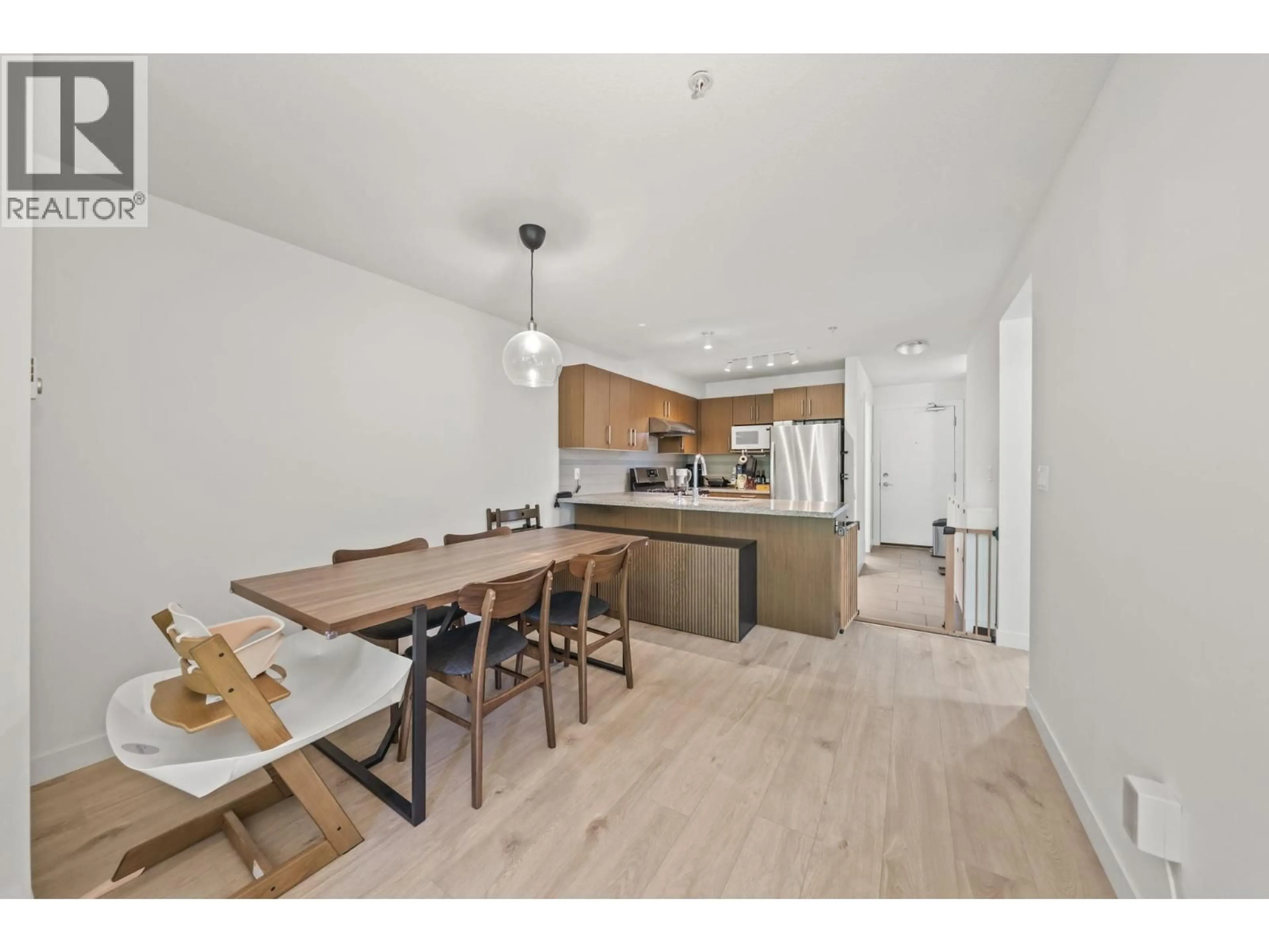 Open concept kitchen, wood/laminate floor for 208 - 6800 ECKERSLEY ROAD, Richmond British Columbia V6Y0E7
