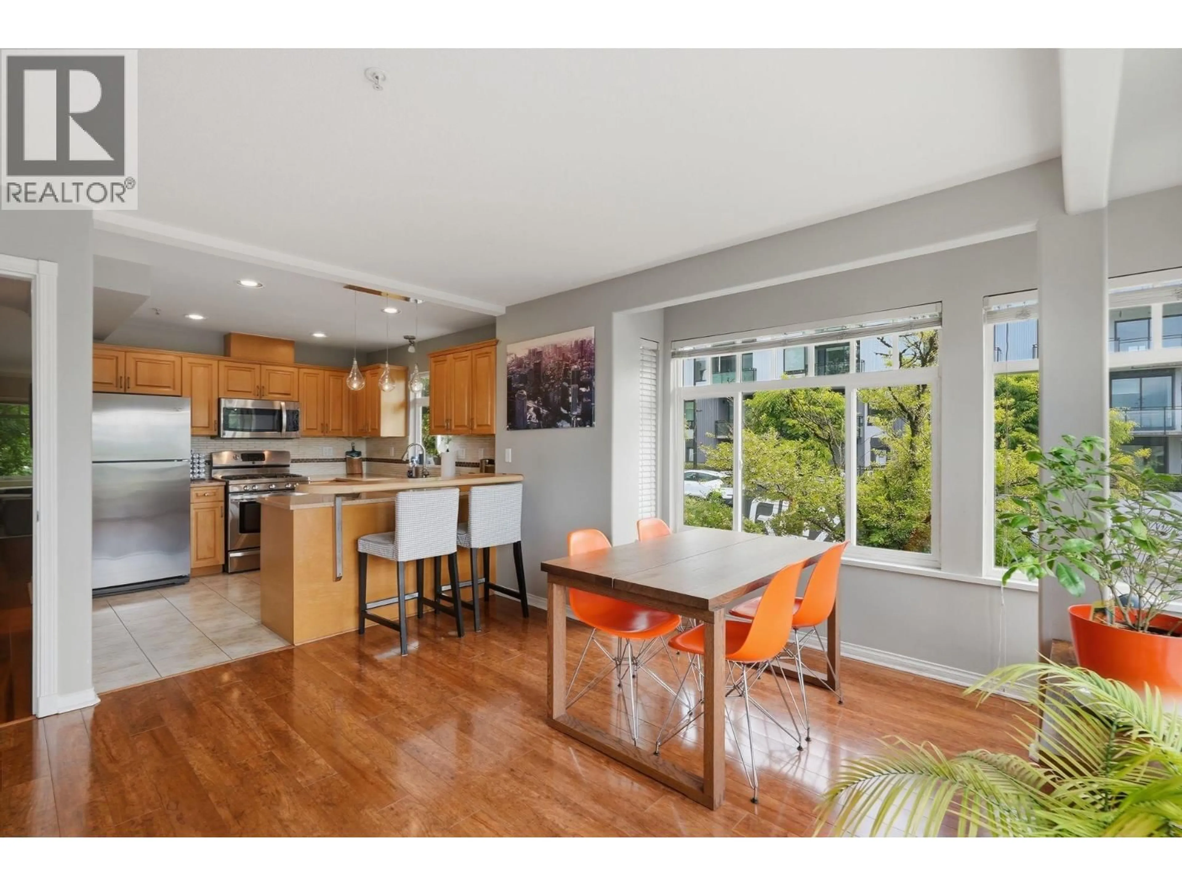 Open concept kitchen, wood/laminate floor for 203 6TH STREET, North Vancouver British Columbia V7M1K7