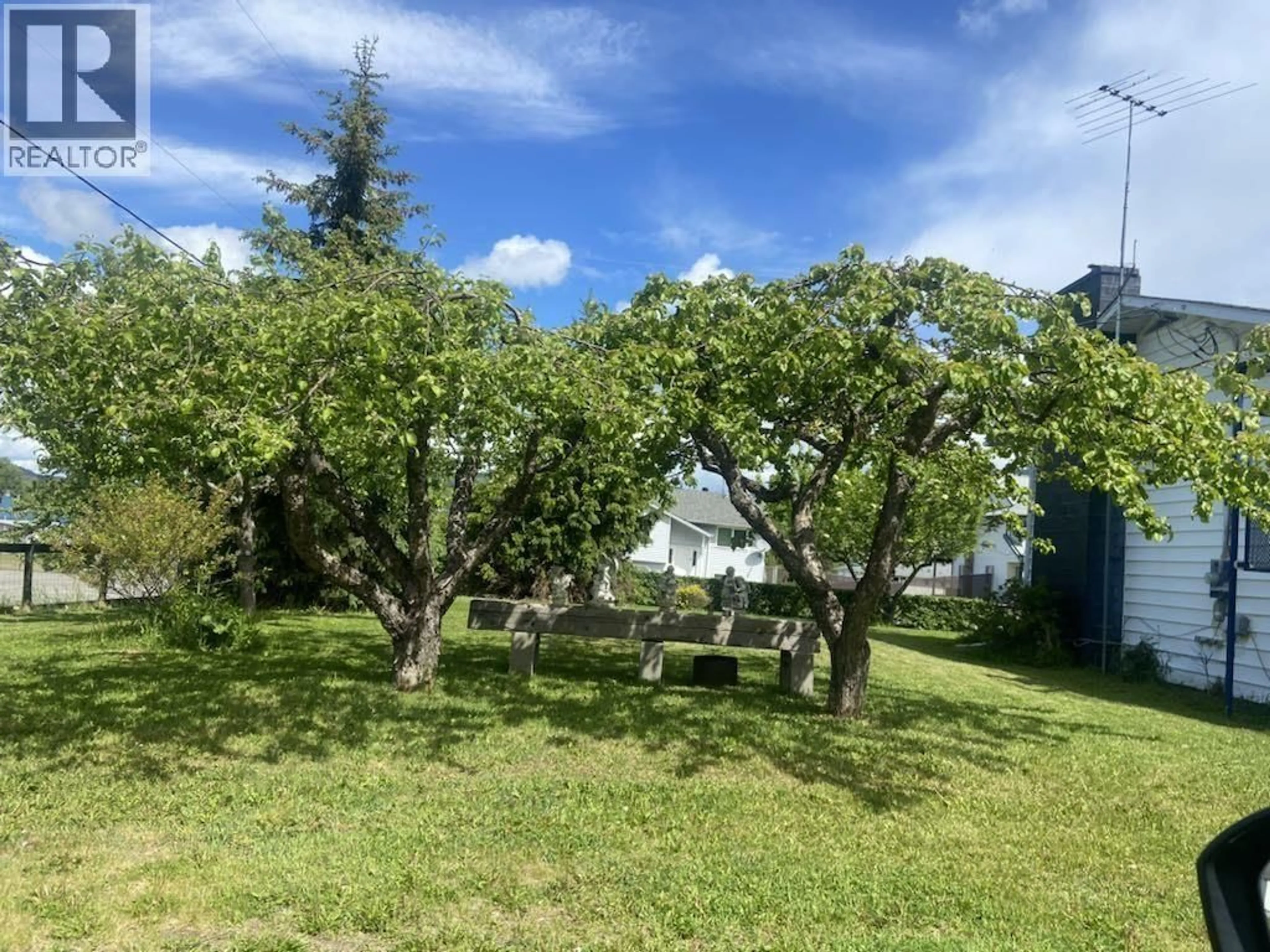 A pic from outside/outdoor area/front of a property/back of a property/a pic from drone, forest/trees view for 4522 13TH AVENUE, New Hazelton British Columbia V0J2J0