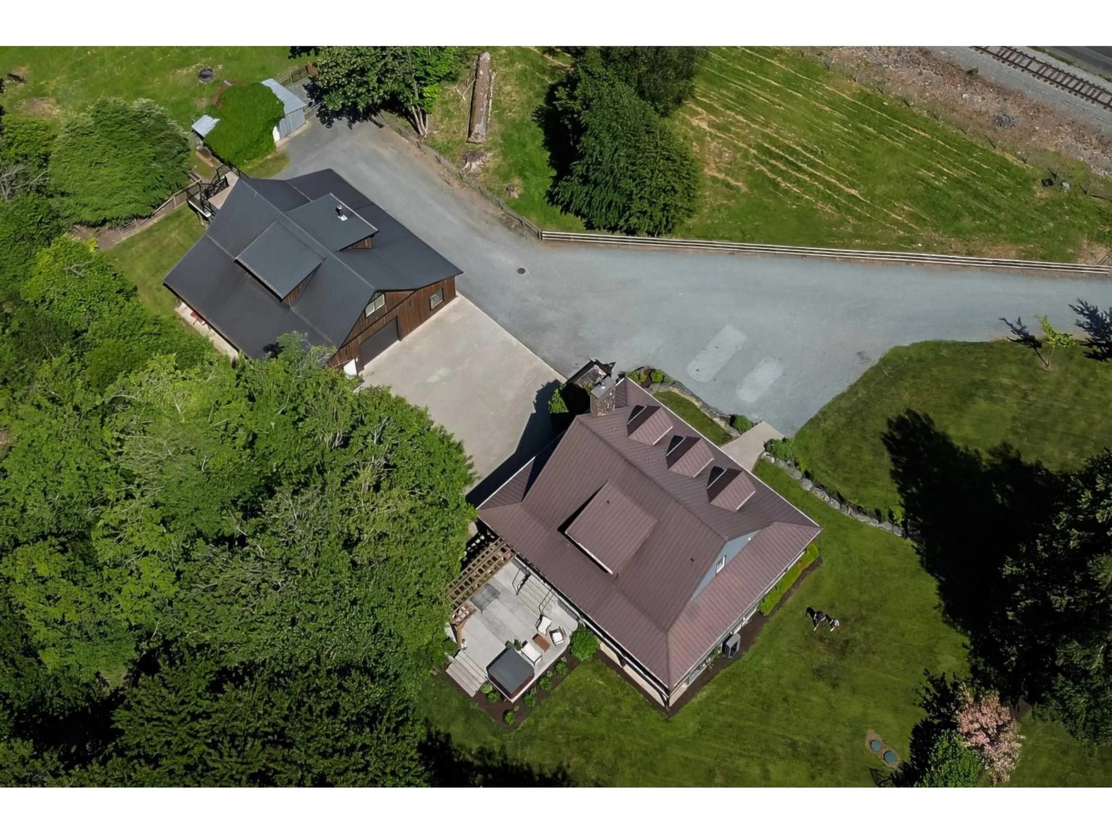 A pic from outside/outdoor area/front of a property/back of a property/a pic from drone, street for 5395 HOOGE ROAD, Sardis - Greendale British Columbia V2R4B4