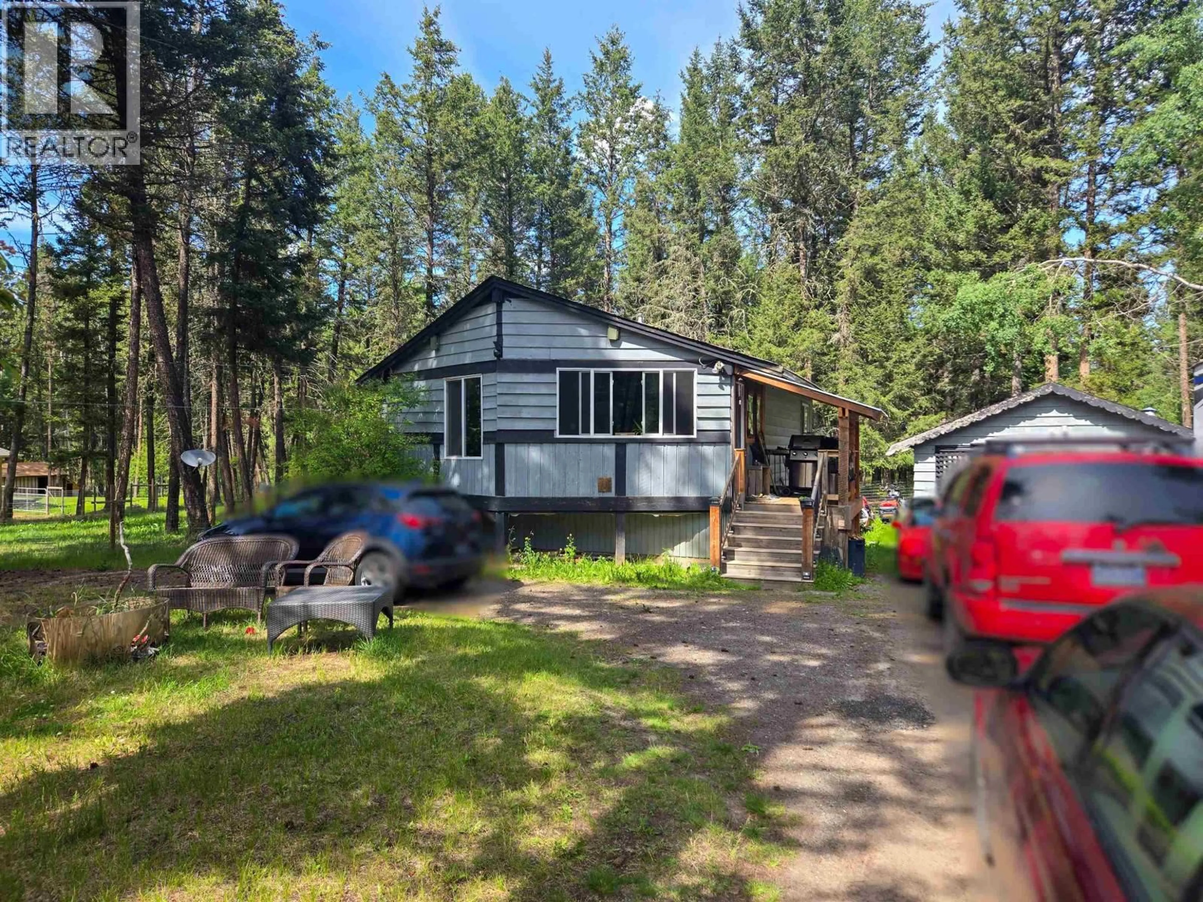 A pic from outside/outdoor area/front of a property/back of a property/a pic from drone, unknown for 4987 SMITH ROAD, 108 Mile Ranch British Columbia V0K2Z0