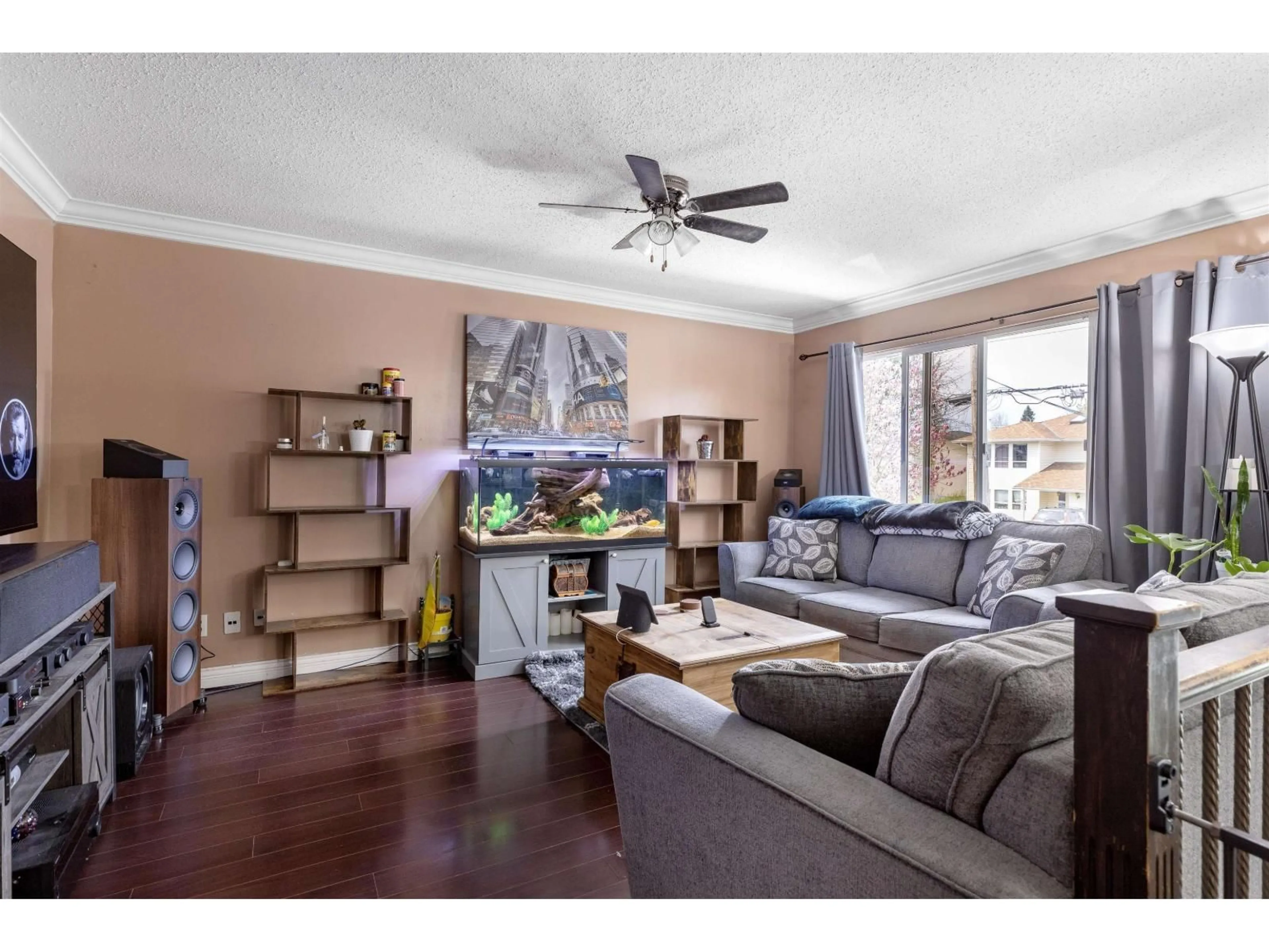 Living room with furniture, wood/laminate floor for 7570 MAY STREET, Mission British Columbia V2V3E1