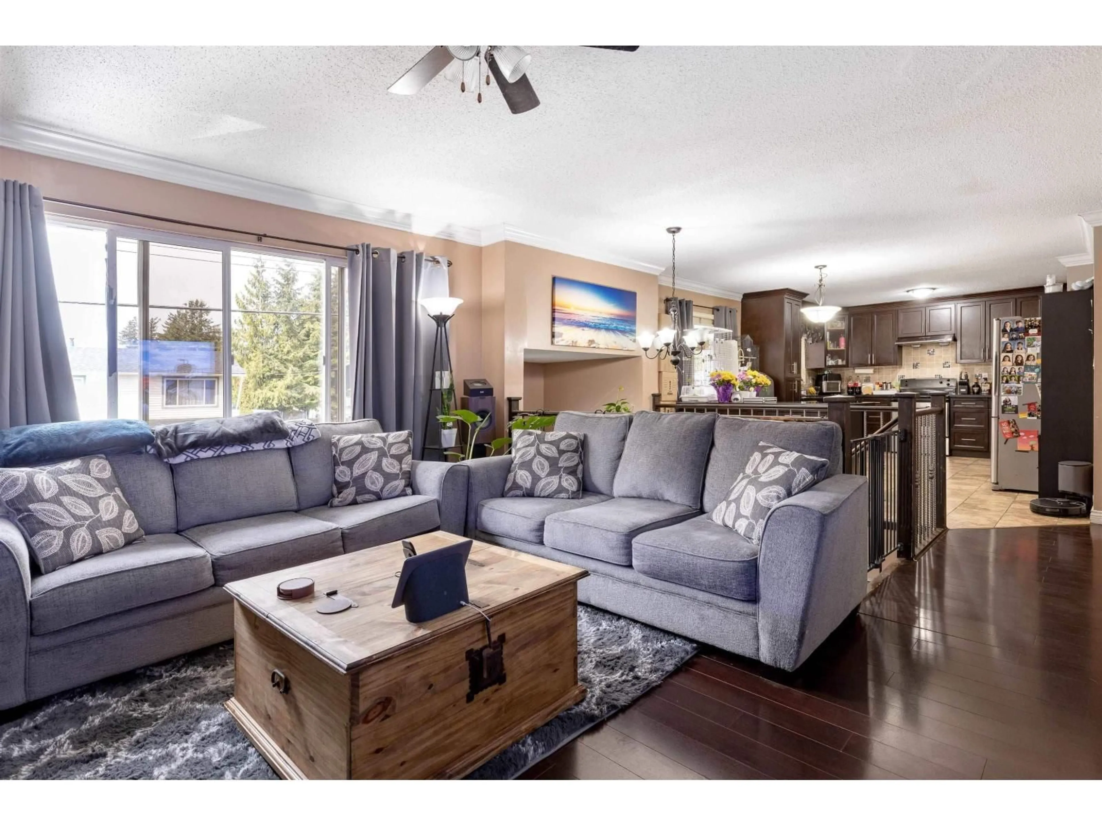 Living room with furniture, wood/laminate floor for 7570 MAY STREET, Mission British Columbia V2V3E1