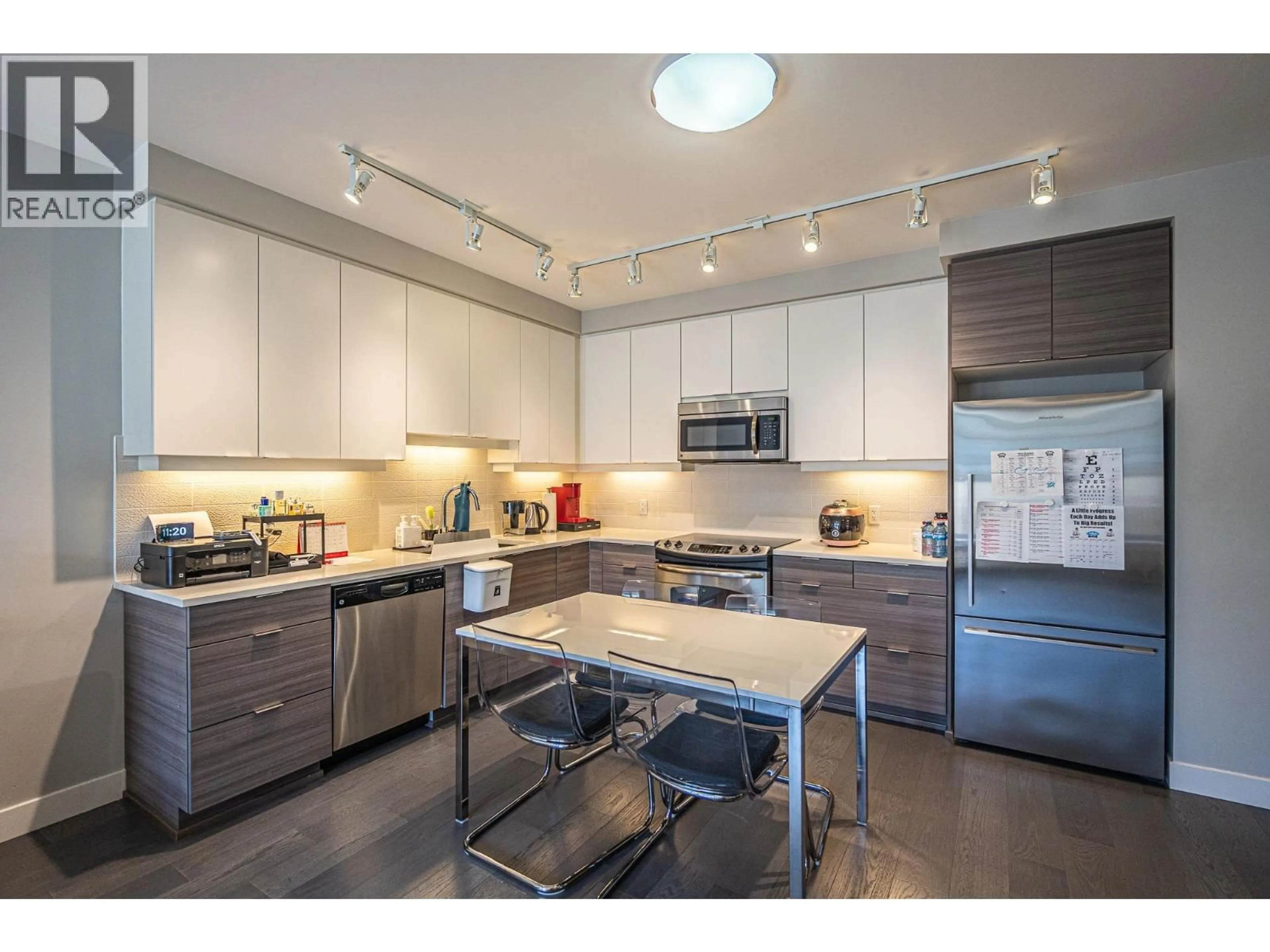 Open concept kitchen, wood/laminate floor for 306 - 9393 TOWER ROAD, Burnaby British Columbia V5A0E2