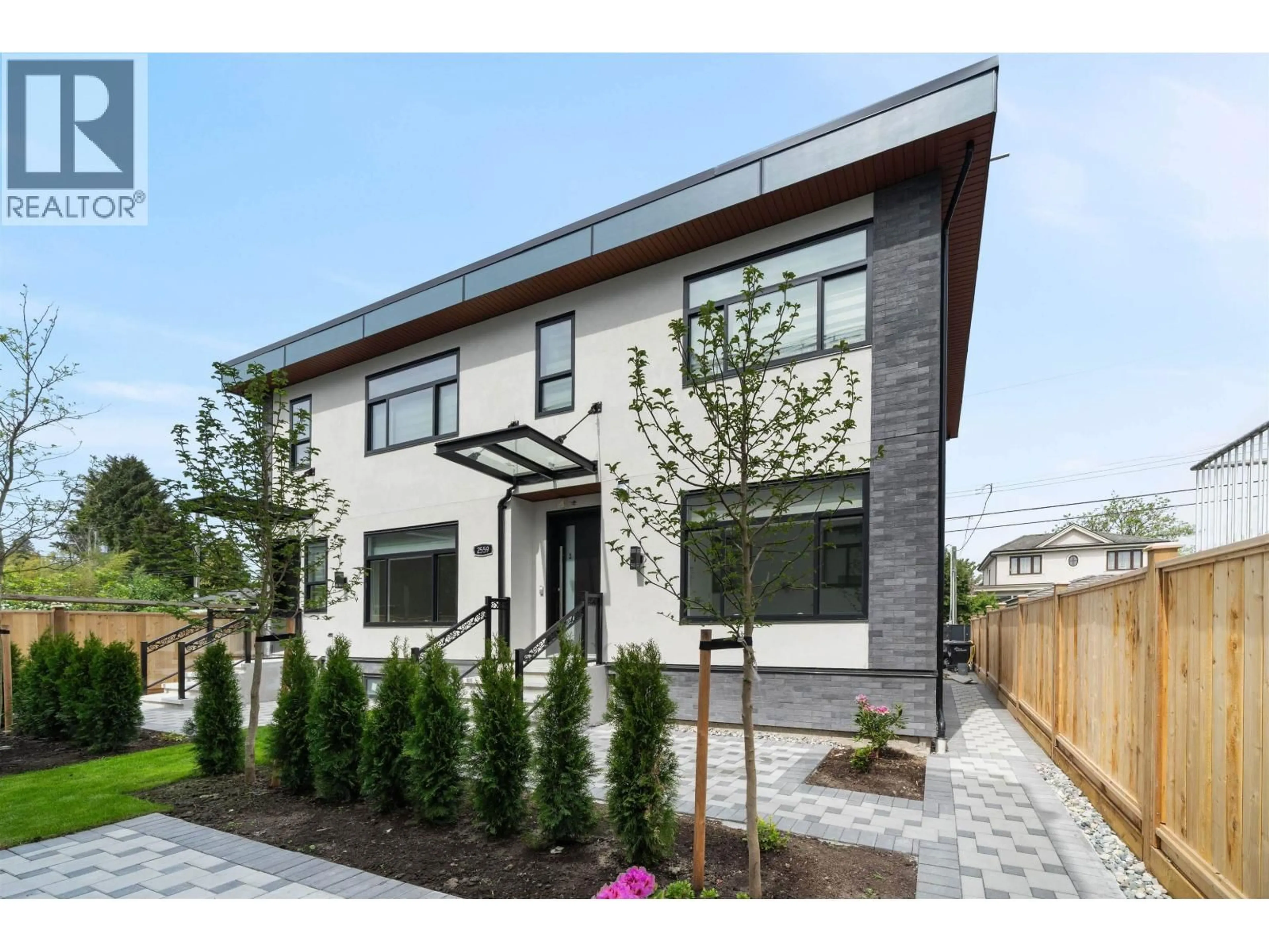Home with brick exterior material, street for #2 - 2559 KING EDWARD AVENUE, Vancouver British Columbia V6L1T5