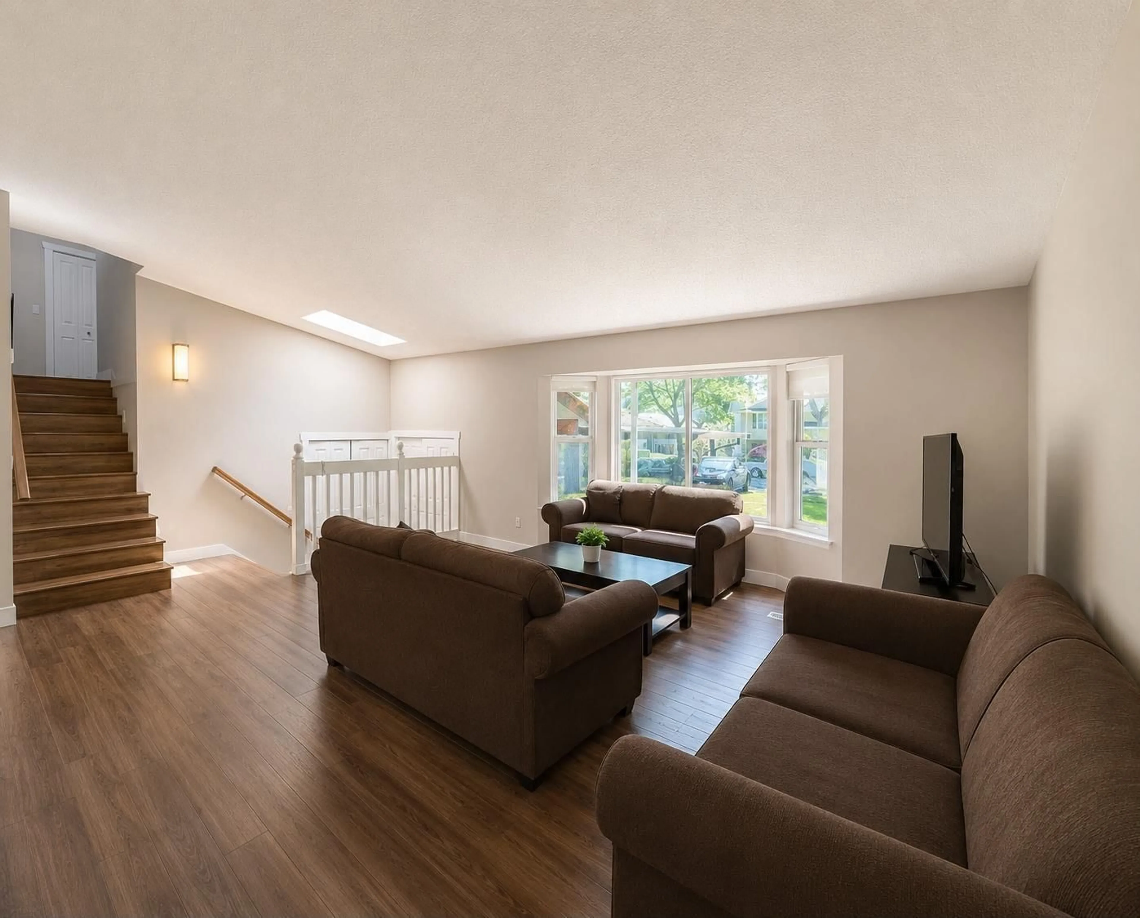 Living room with furniture, wood/laminate floor for 14565 91A AVENUE, Surrey British Columbia V3R7K6