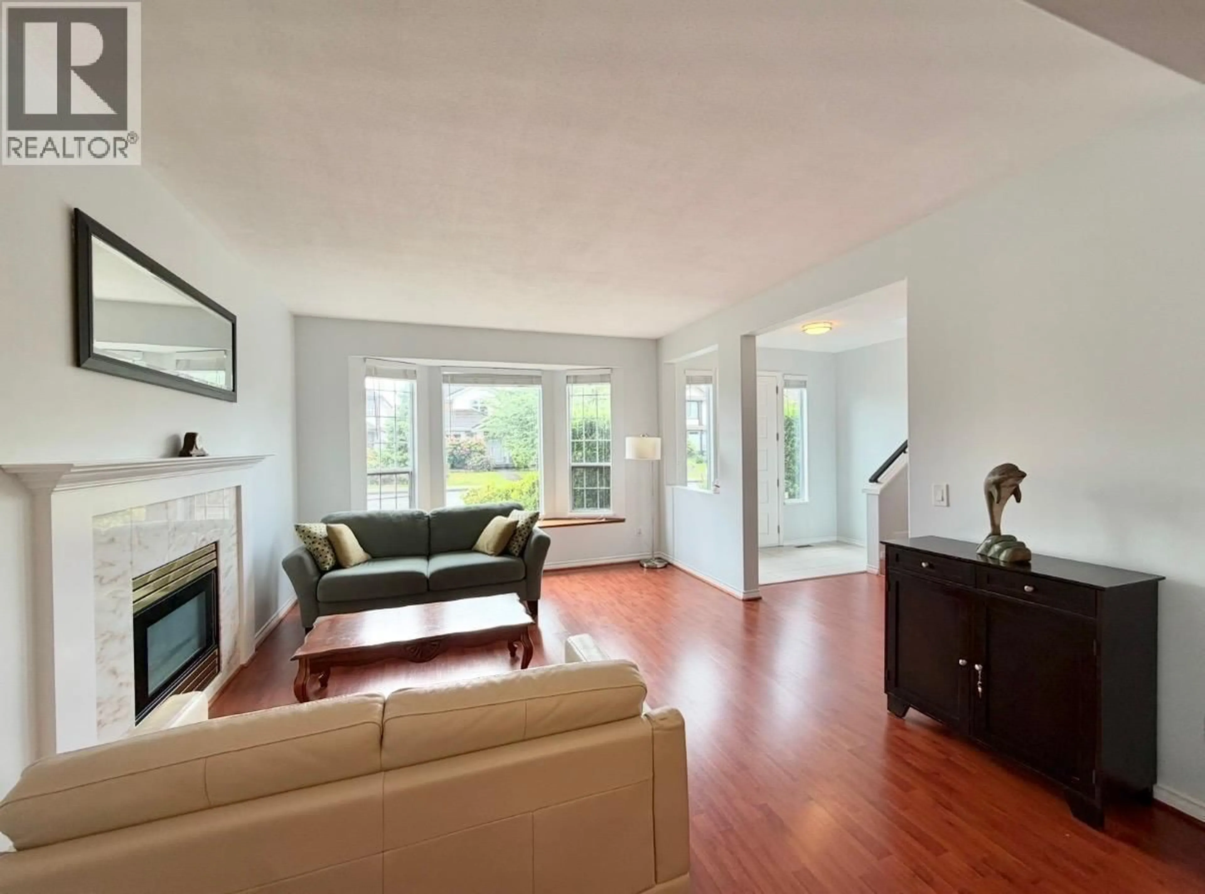 Living room with furniture, wood/laminate floor for 1463 RIVERWOOD GATE, Port Coquitlam British Columbia V3B7P1
