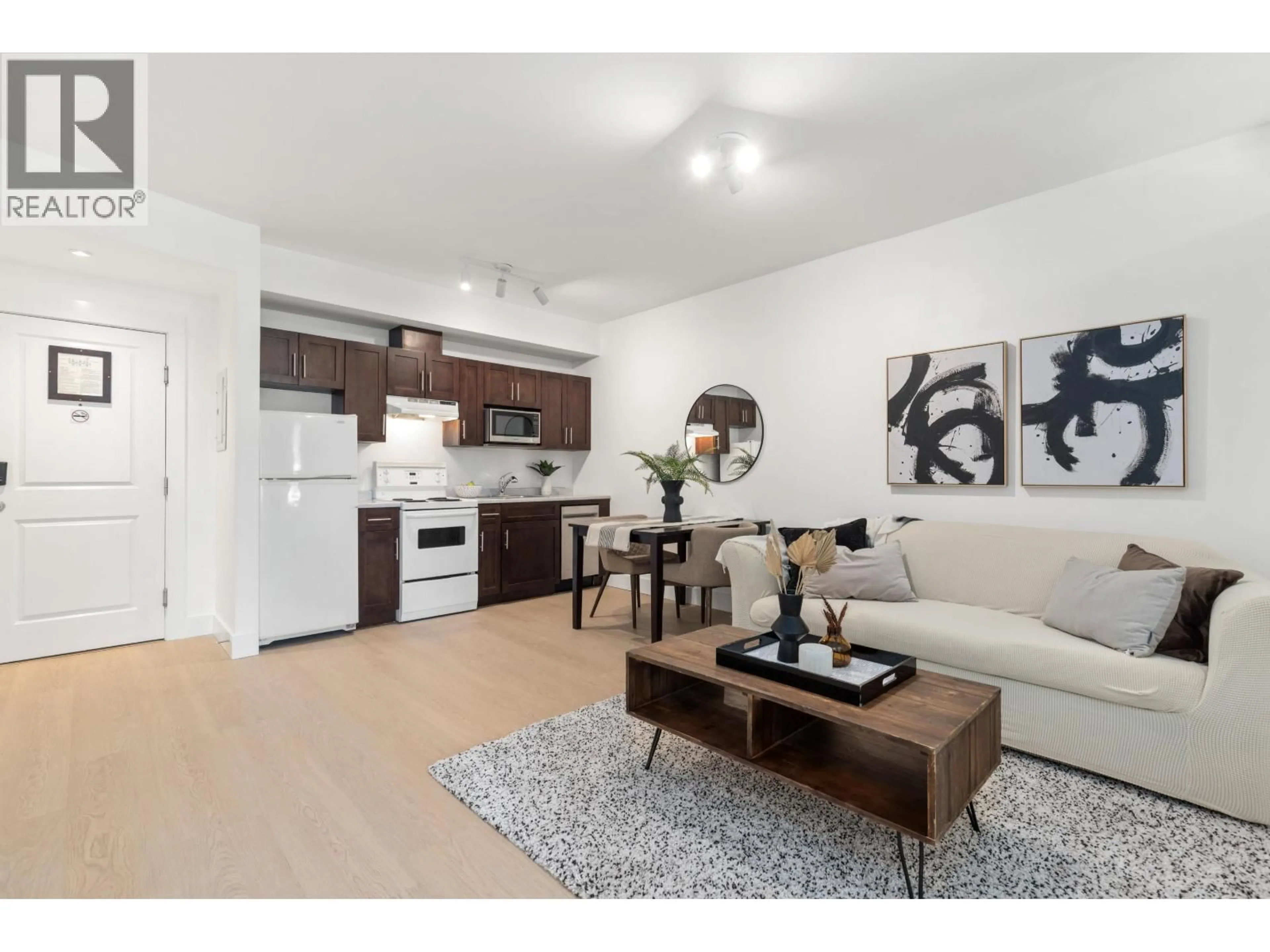 Living room with furniture, wood/laminate floor for 302 - 7330 ARBUTUS STREET, Pemberton British Columbia V0N2L1