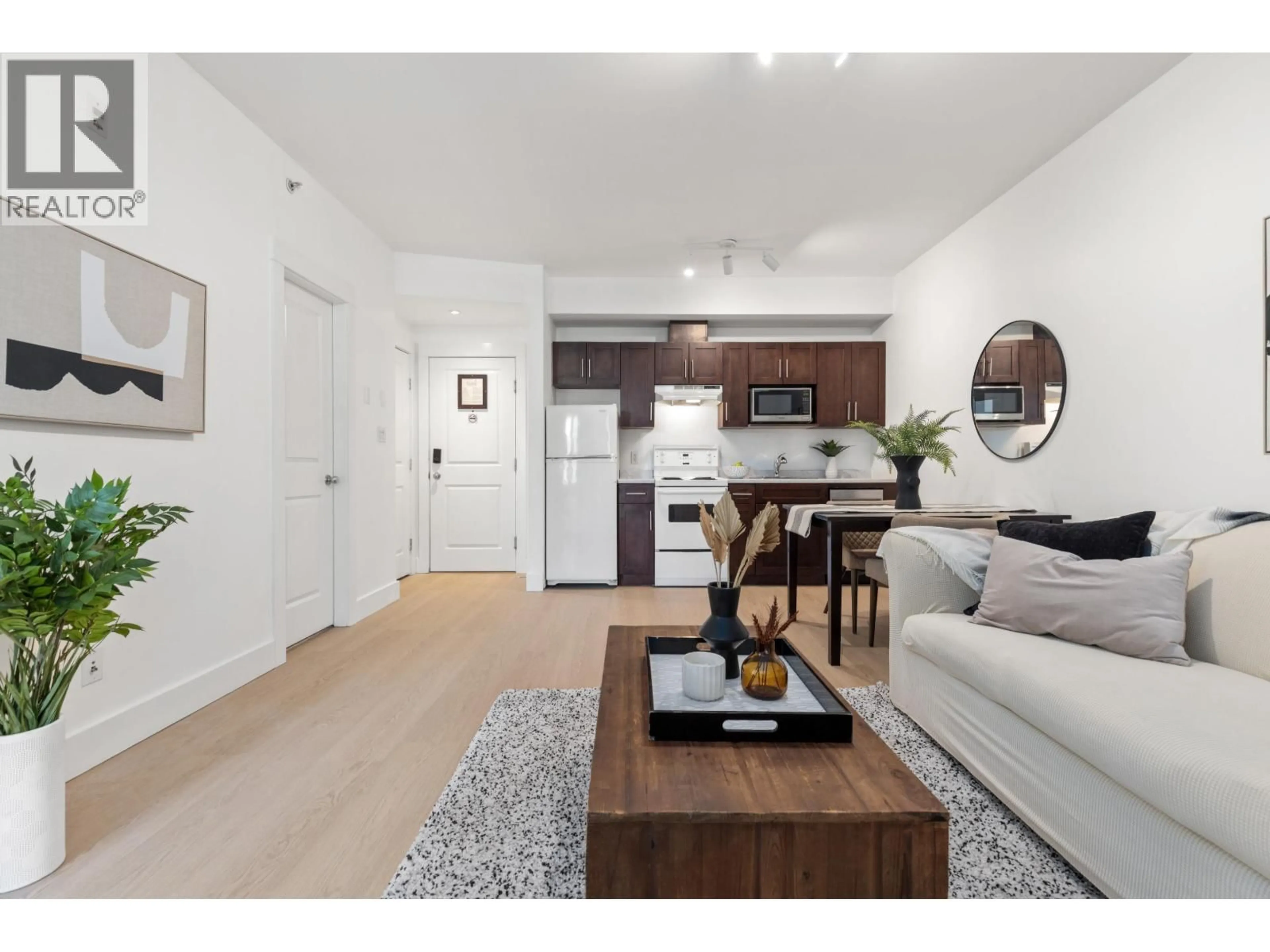 Living room with furniture, wood/laminate floor for 302 - 7330 ARBUTUS STREET, Pemberton British Columbia V0N2L1