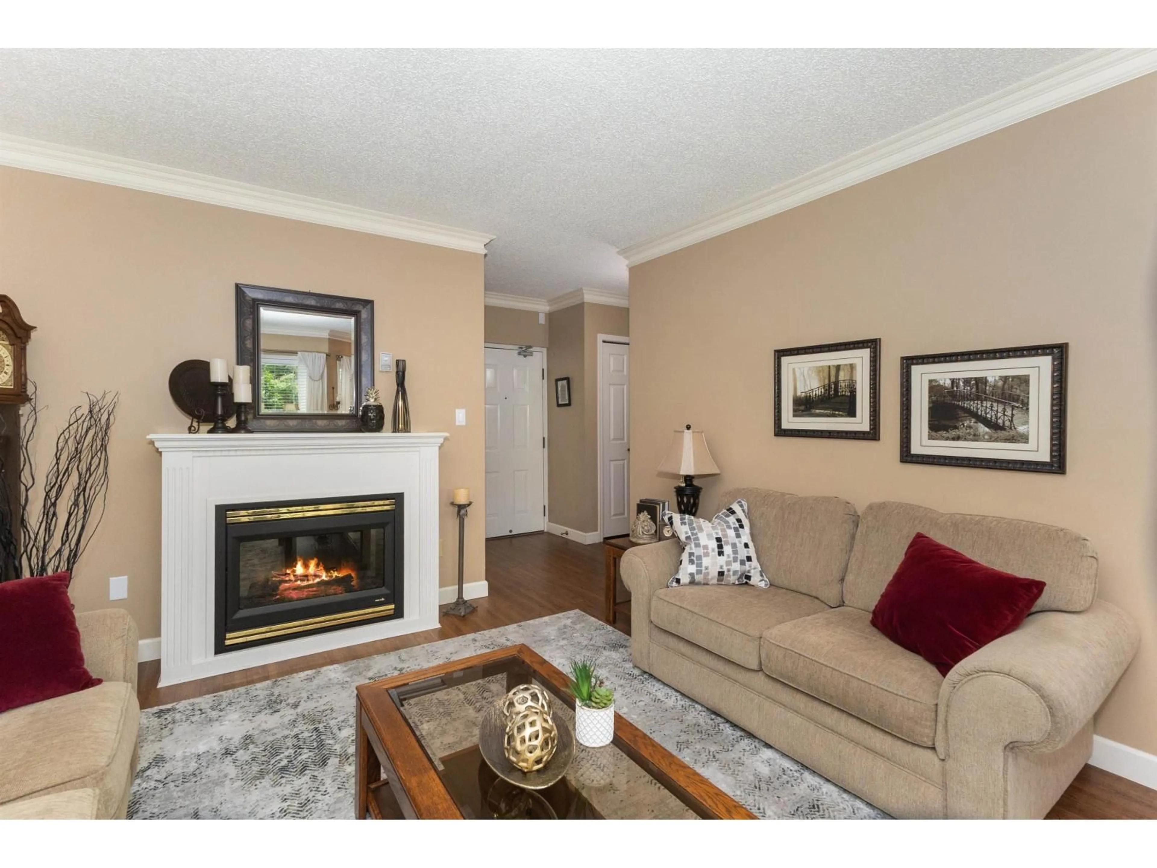 Living room with furniture, wood/laminate floor for 121 - 31955 OLD YALE ROAD, Abbotsford British Columbia V2T4N1