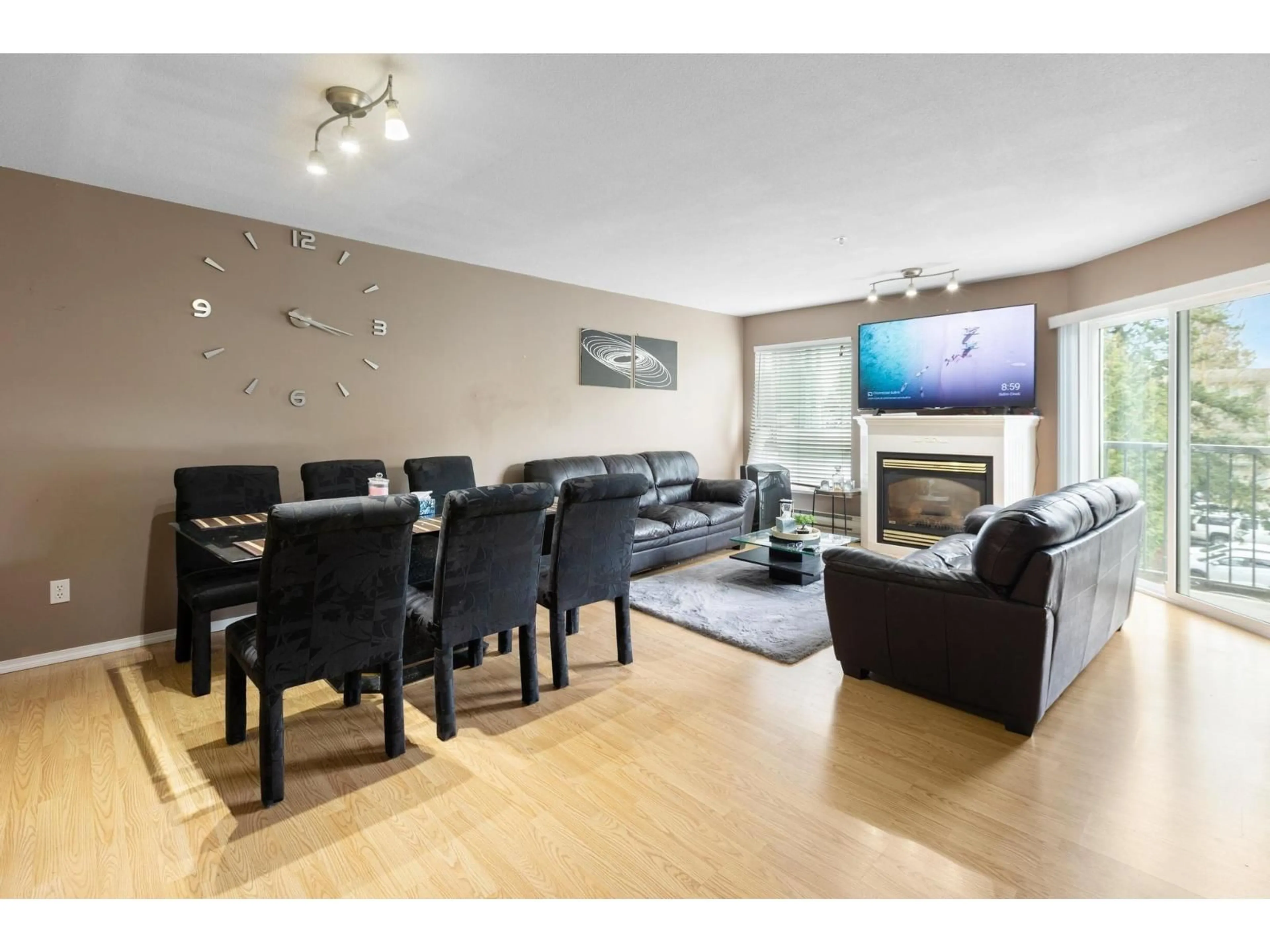Living room with furniture, wood/laminate floor for 305 - 31831 PEARDONVILLE ROAD, Abbotsford British Columbia V2T1L5