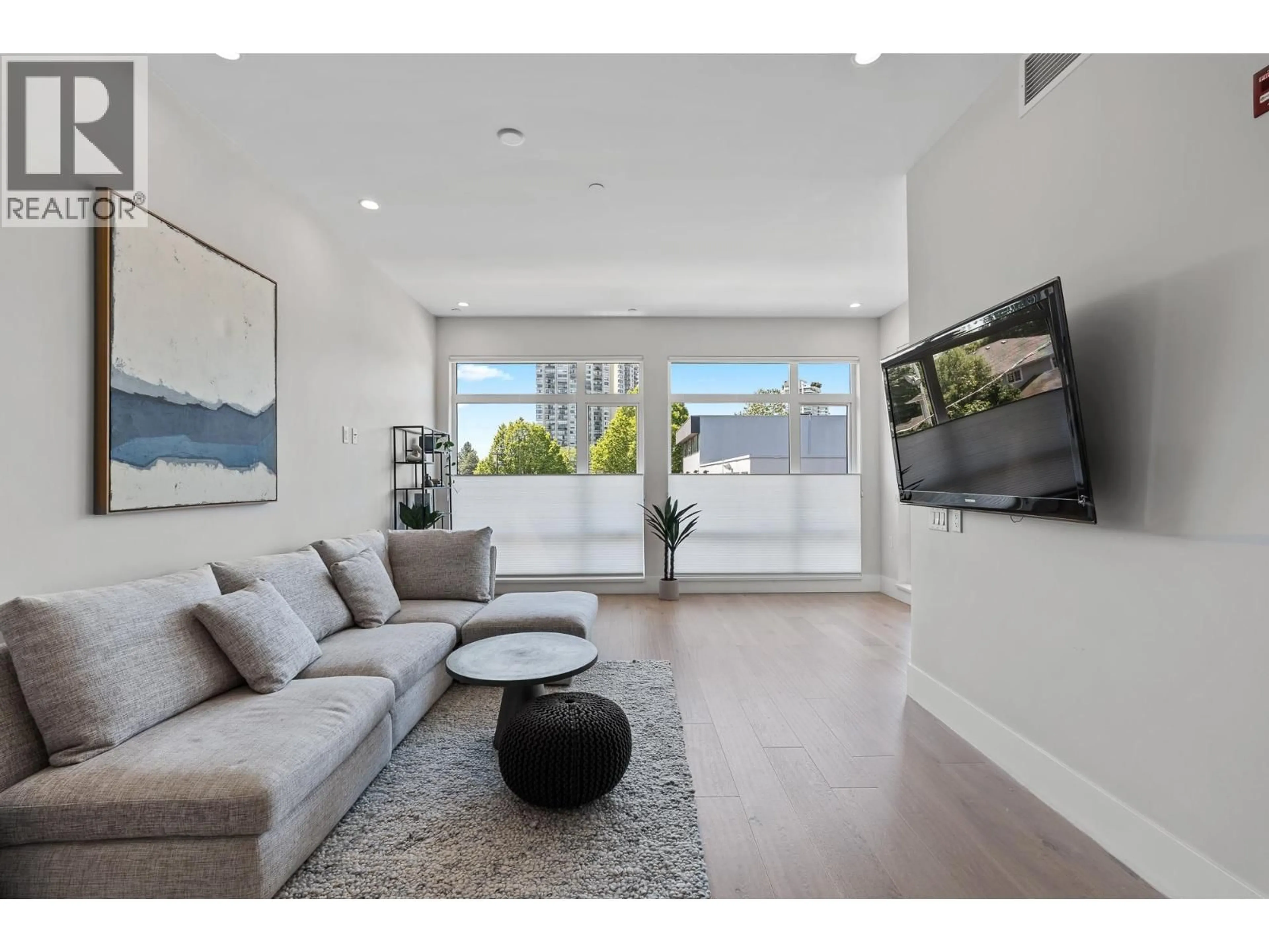 Living room with furniture, unknown for 206 - 1591 BOWSER AVENUE, North Vancouver British Columbia V7P2Y4