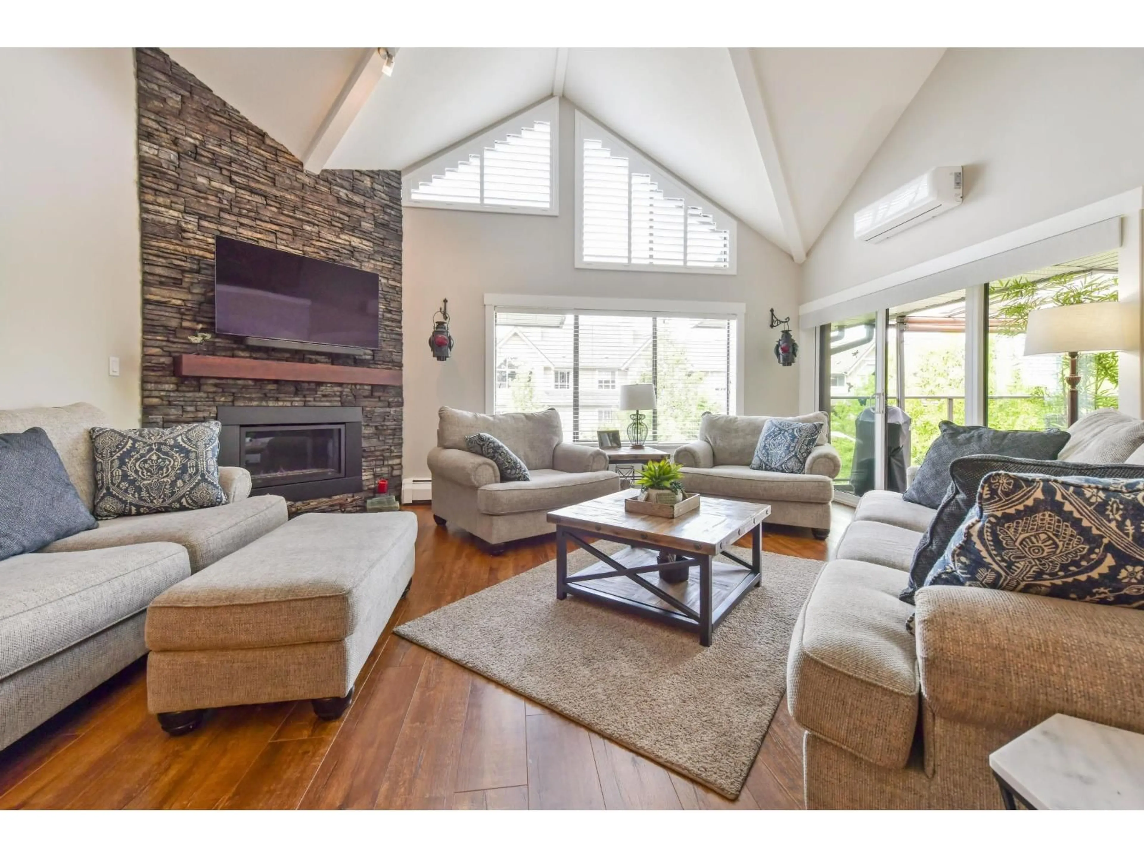Living room with furniture, wood/laminate floor for 311 - 15270 17TH AVENUE, Surrey British Columbia V4A1T9