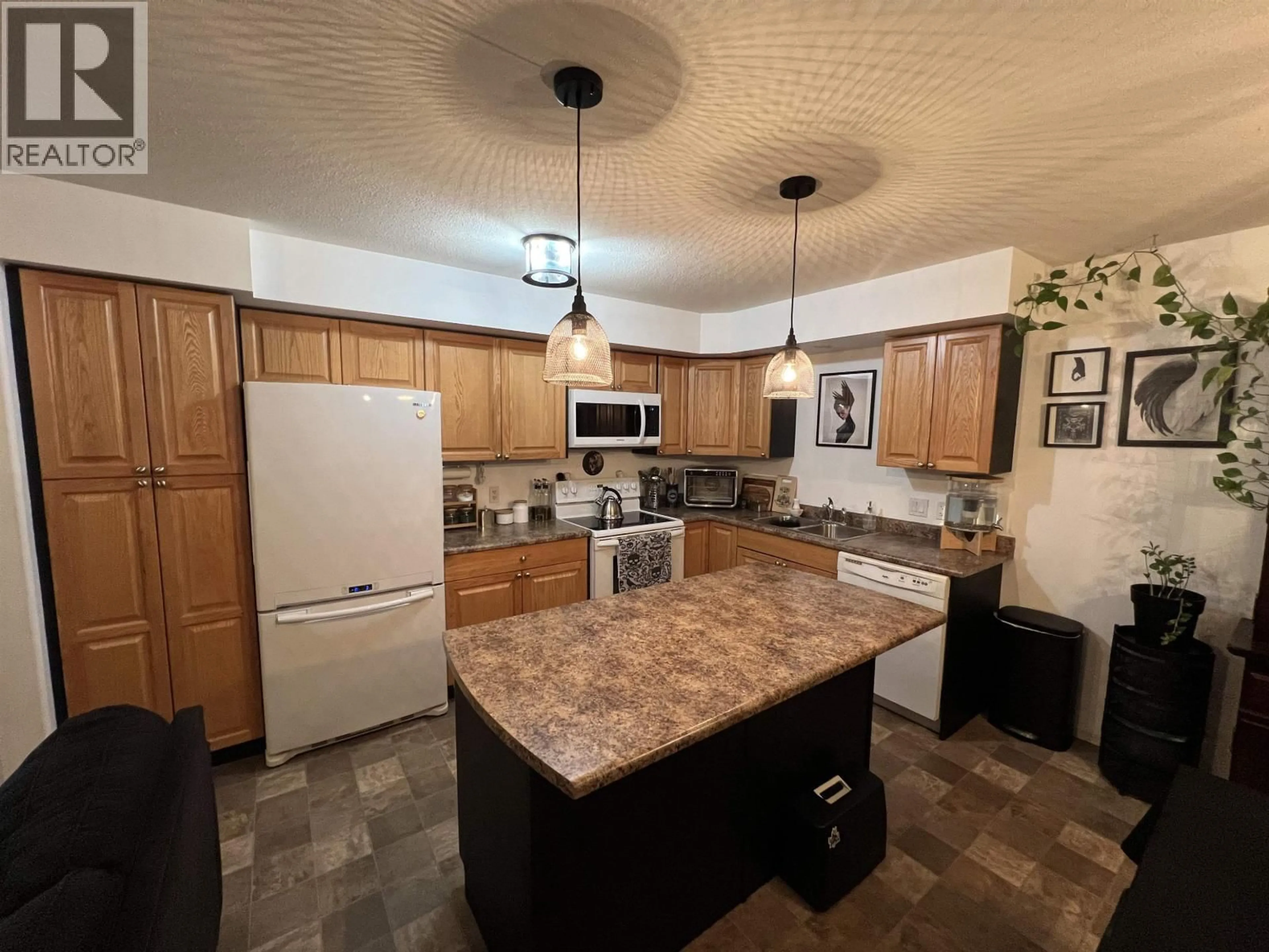 Open concept kitchen, ceramic/tile floor for 7 - 4620 52 AVENUE, Fort Nelson British Columbia V0C1R0