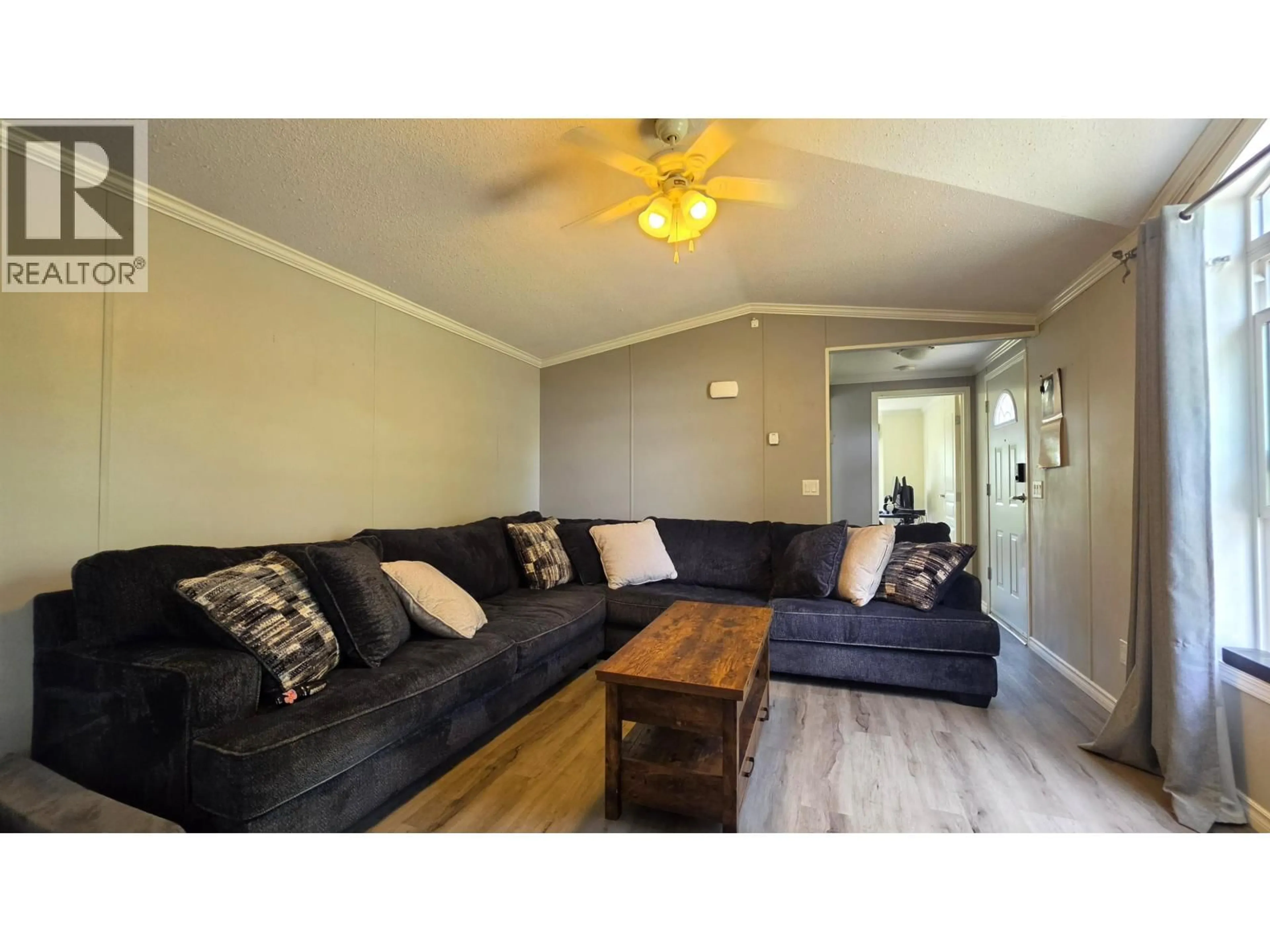 Living room with furniture, wood/laminate floor for 326 BLACKBURN ROAD, Prince George British Columbia V2N6G1