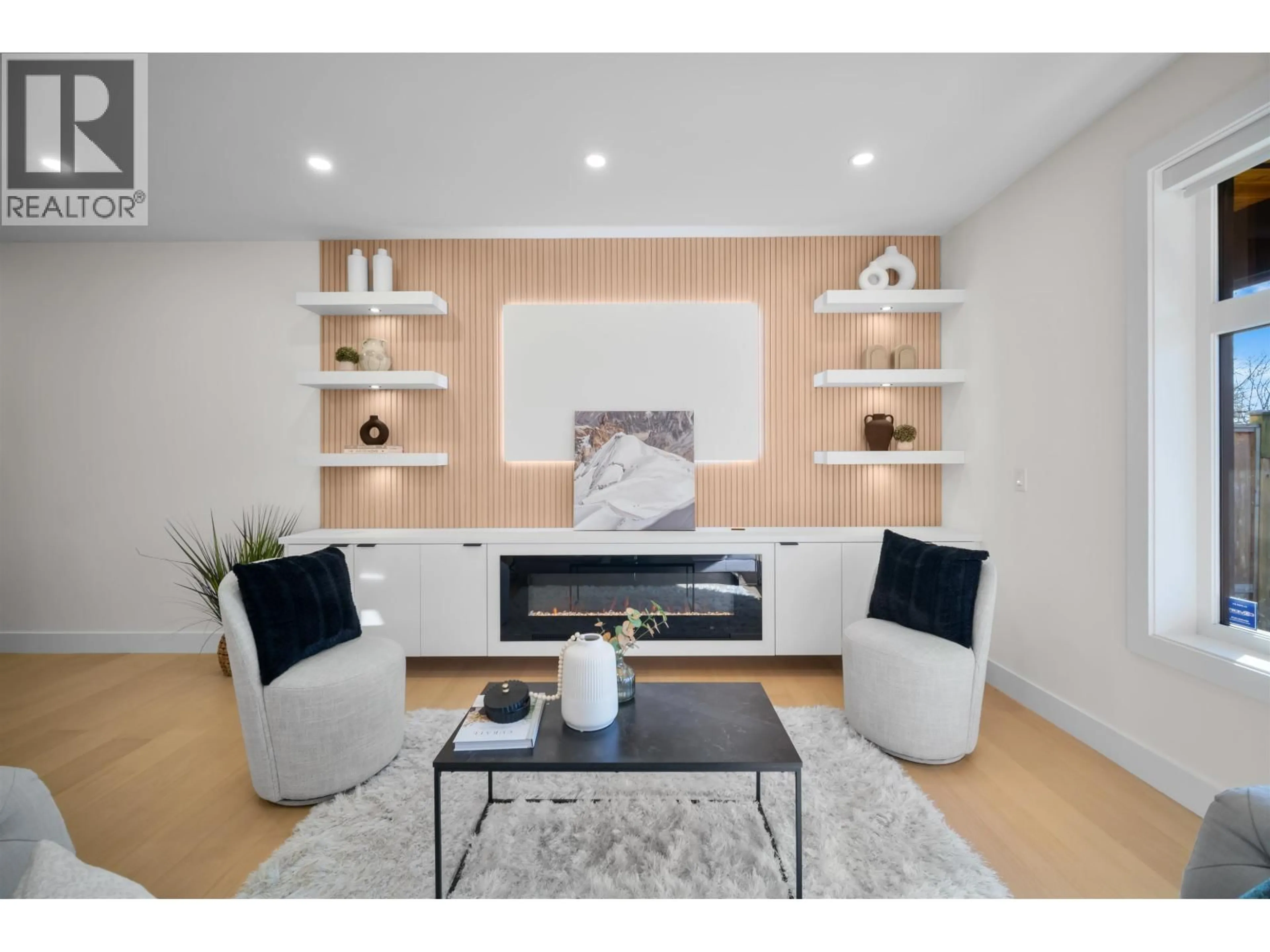 Living room with furniture, wood/laminate floor for 2 - 3576 PENDER STREET, Vancouver British Columbia V5K2E3