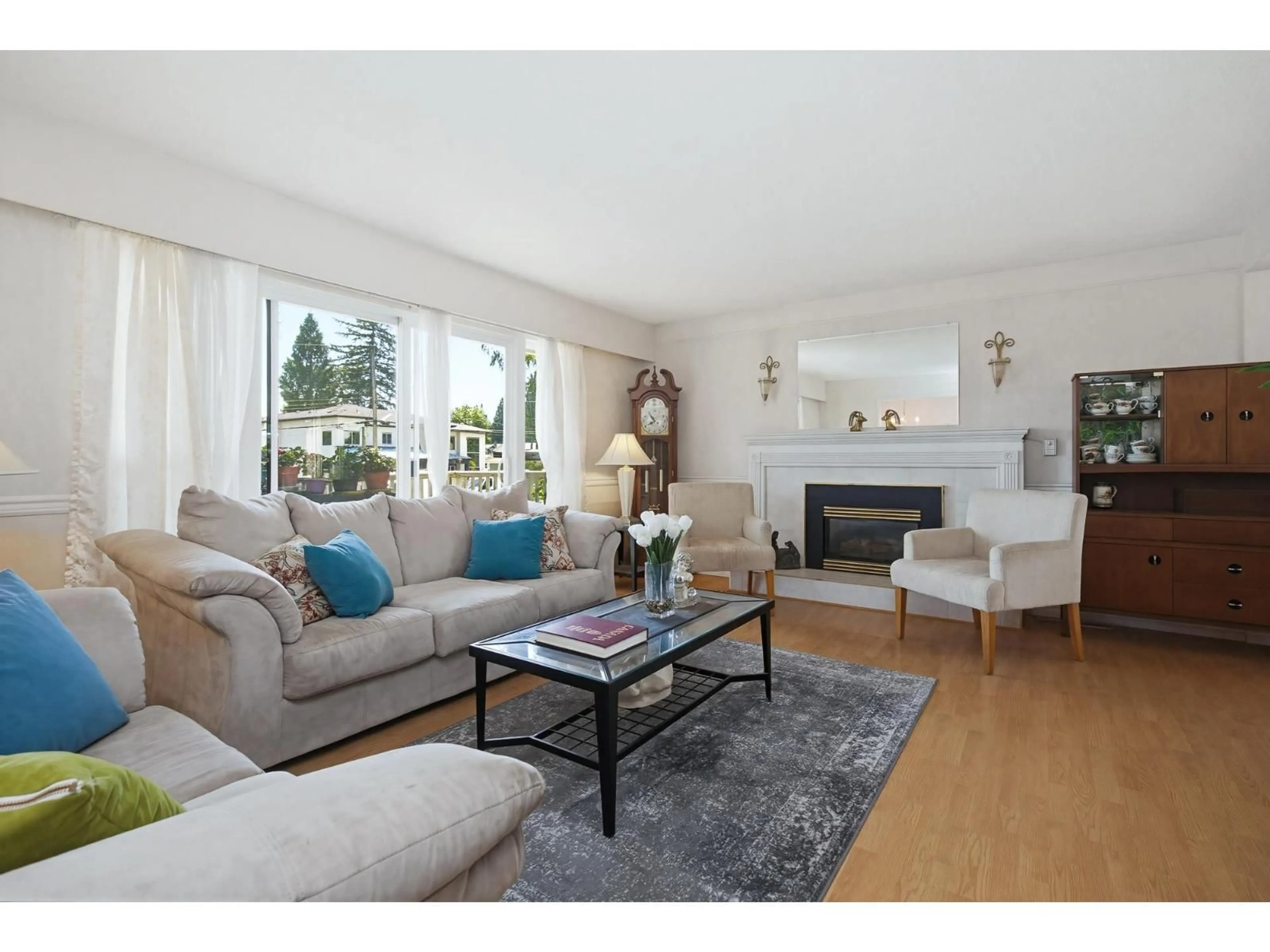 Living room with furniture, wood/laminate floor for 27039 28B AVENUE, Langley British Columbia V4W3A5