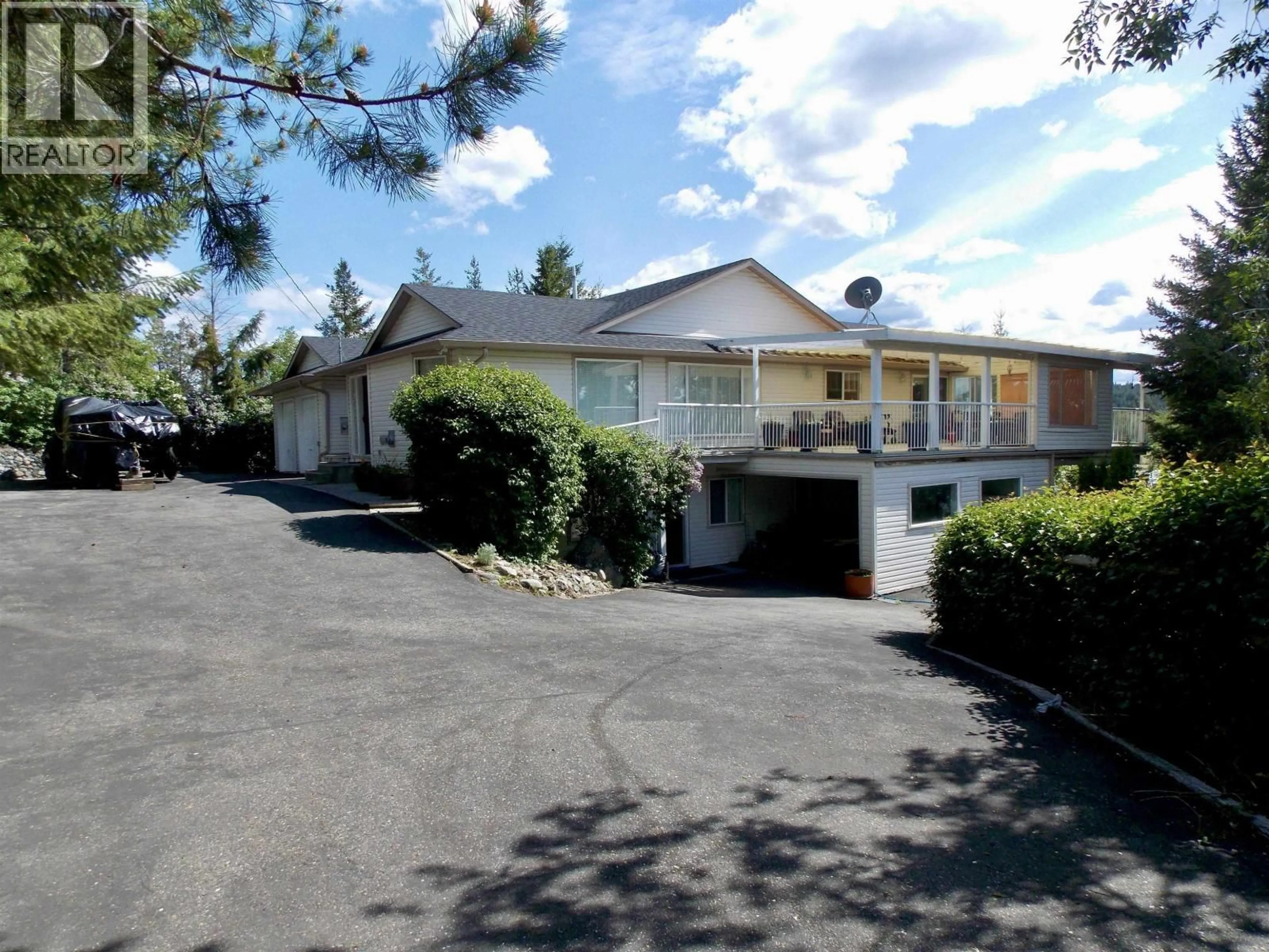 A pic from outside/outdoor area/front of a property/back of a property/a pic from drone, street for 4126 MCKINLEY DRIVE, Lac La Hache British Columbia V0K1T0