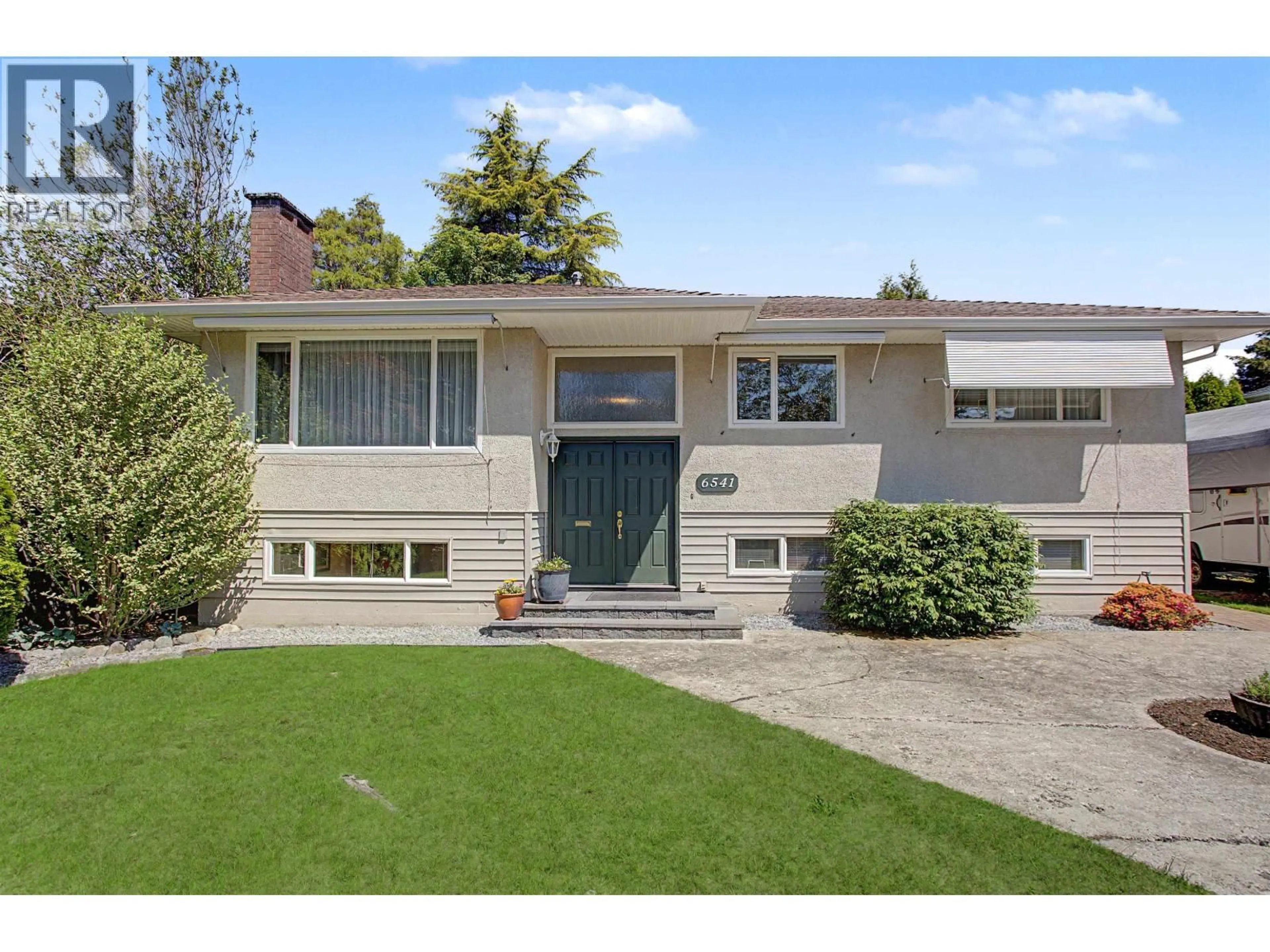 Home with vinyl exterior material, street for 6541 GRANT STREET, Burnaby British Columbia V5B2K9
