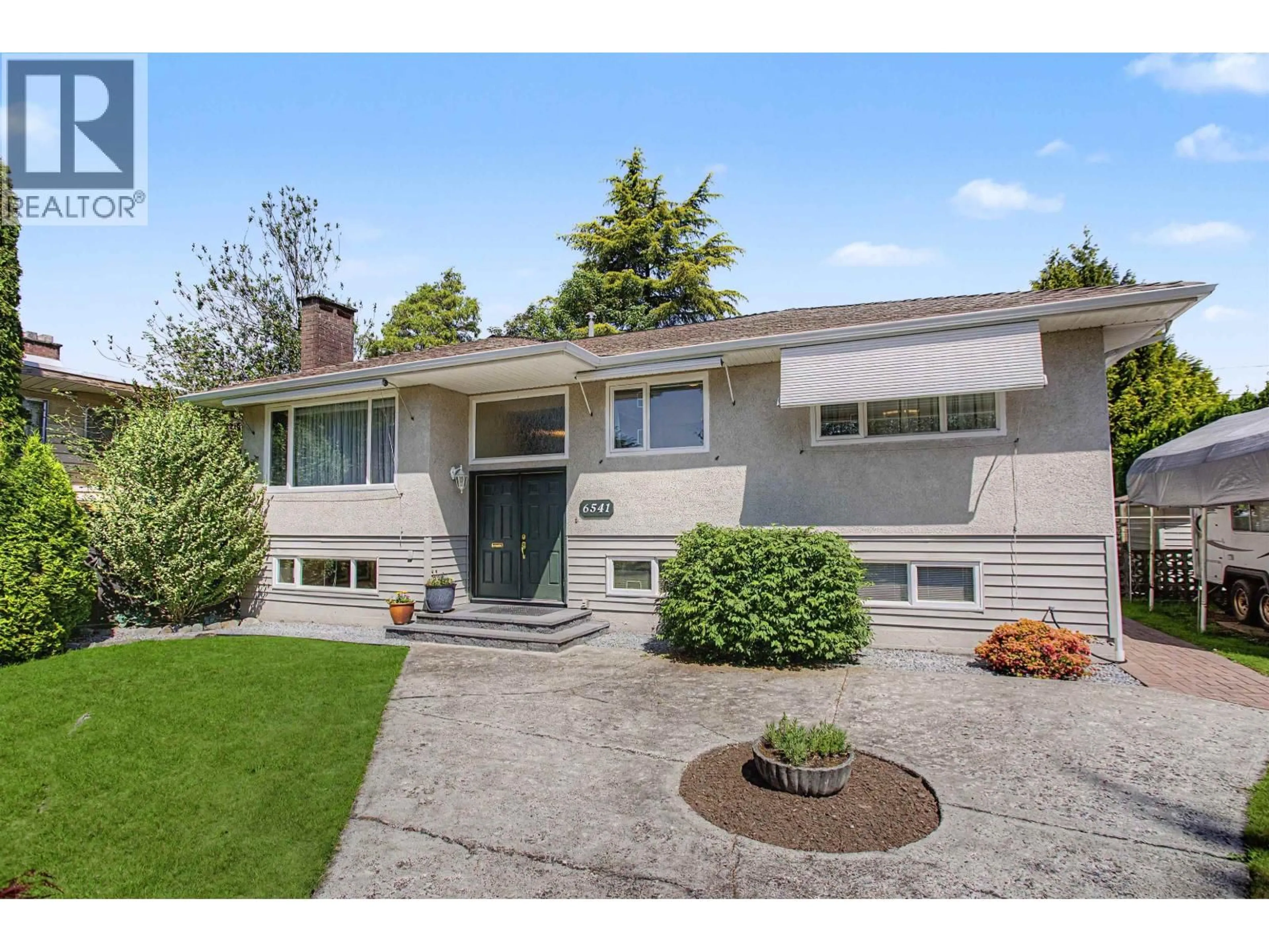 Home with vinyl exterior material, street for 6541 GRANT STREET, Burnaby British Columbia V5B2K9