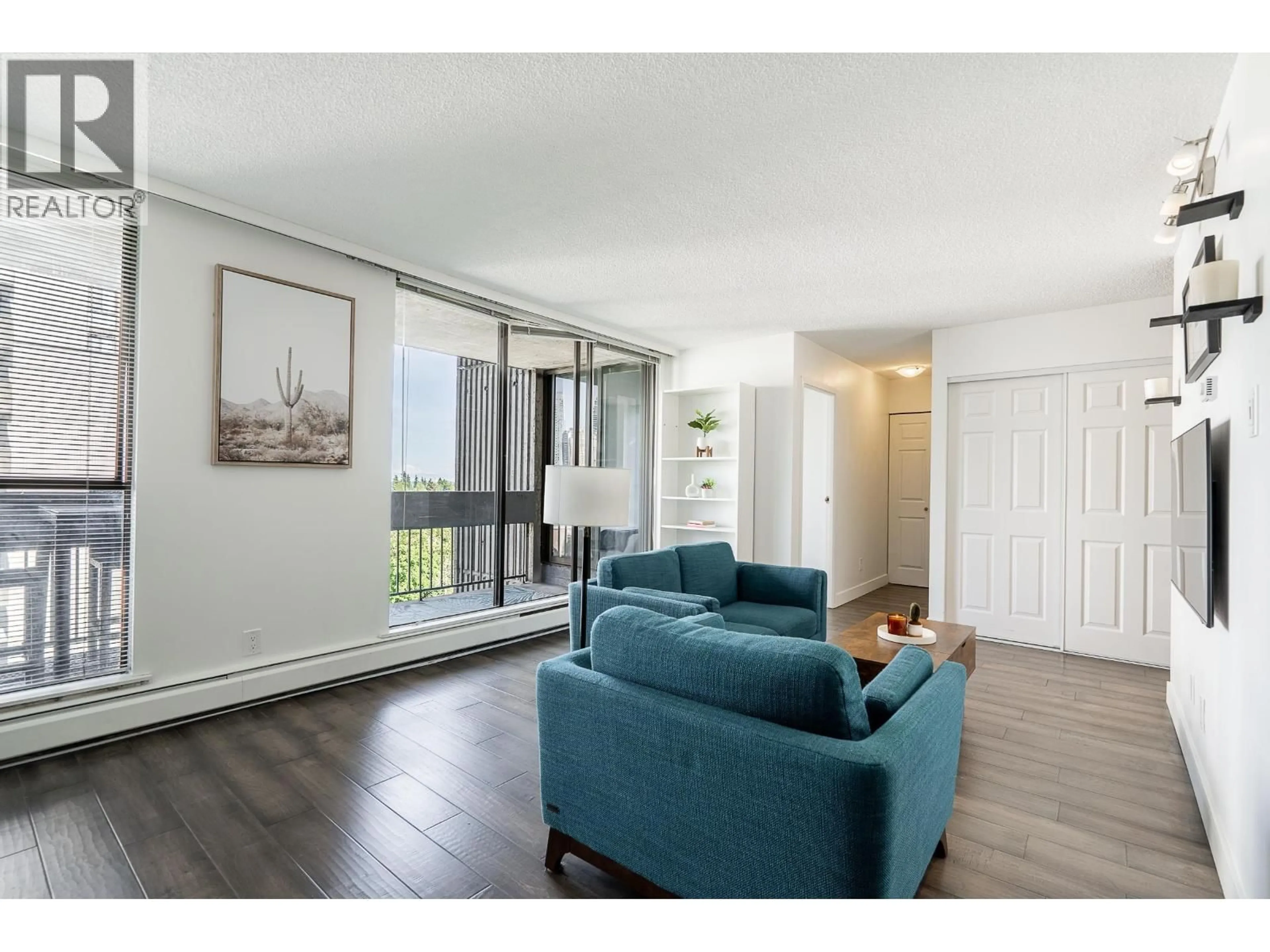Living room with furniture, wood/laminate floor for 902 - 4105 IMPERIAL STREET, Burnaby British Columbia V5J1A6