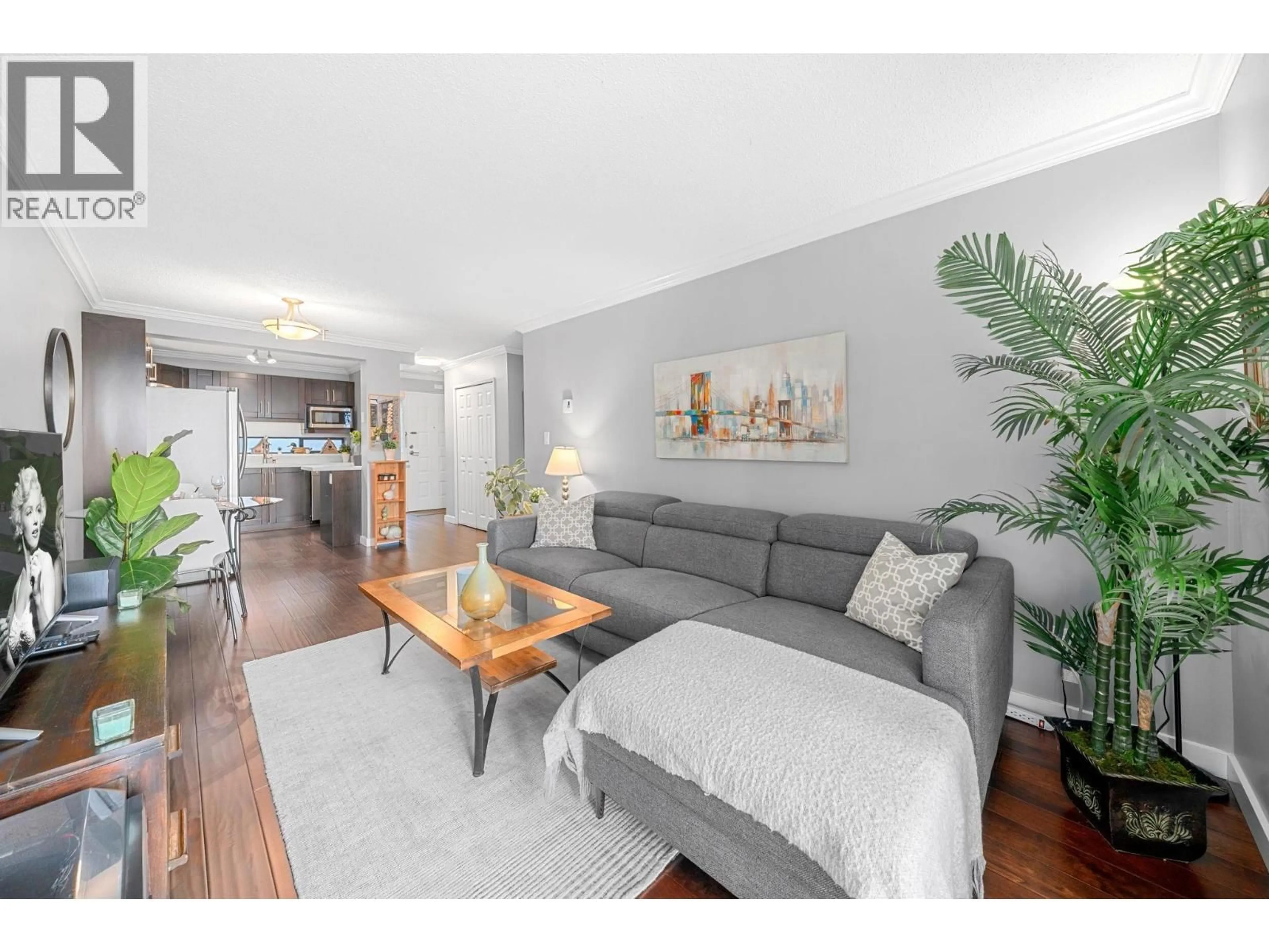 Living room with furniture, wood/laminate floor for 302 - 140 4TH STREET, North Vancouver British Columbia V7L4R1