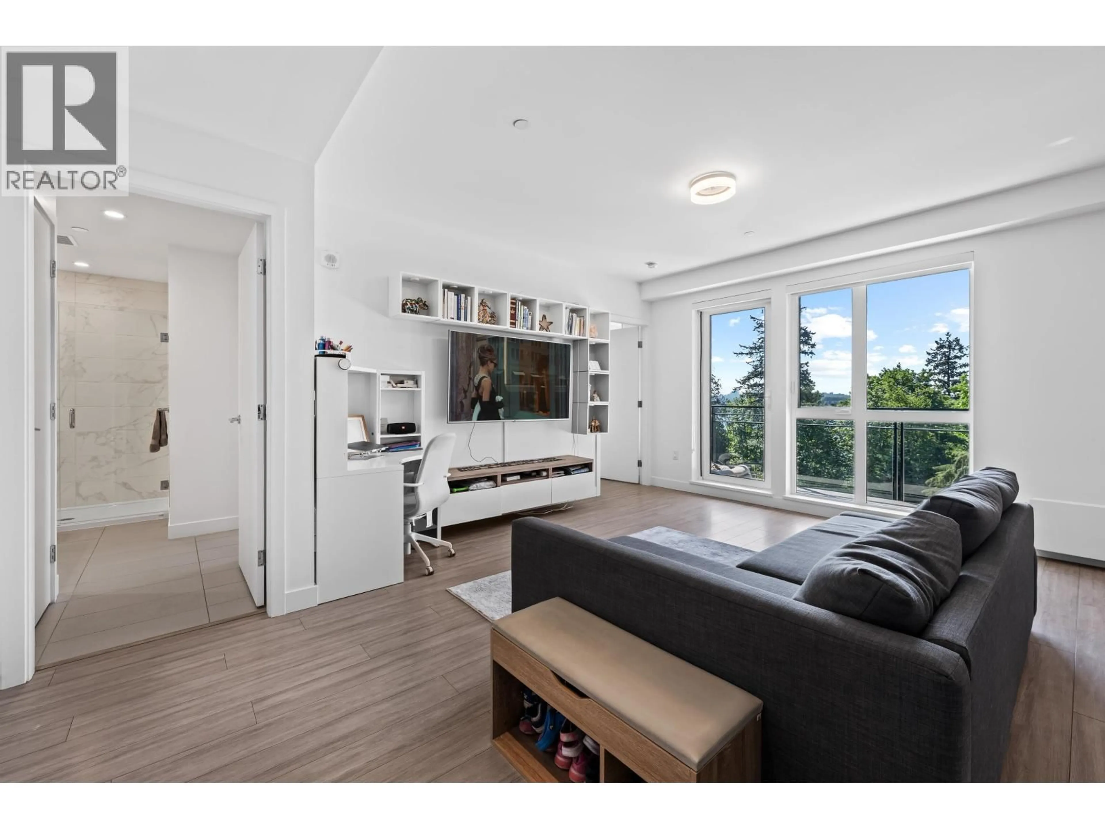 Living room with furniture, wood/laminate floor for 306 - 707 3RD STREET, North Vancouver British Columbia V7L1G8