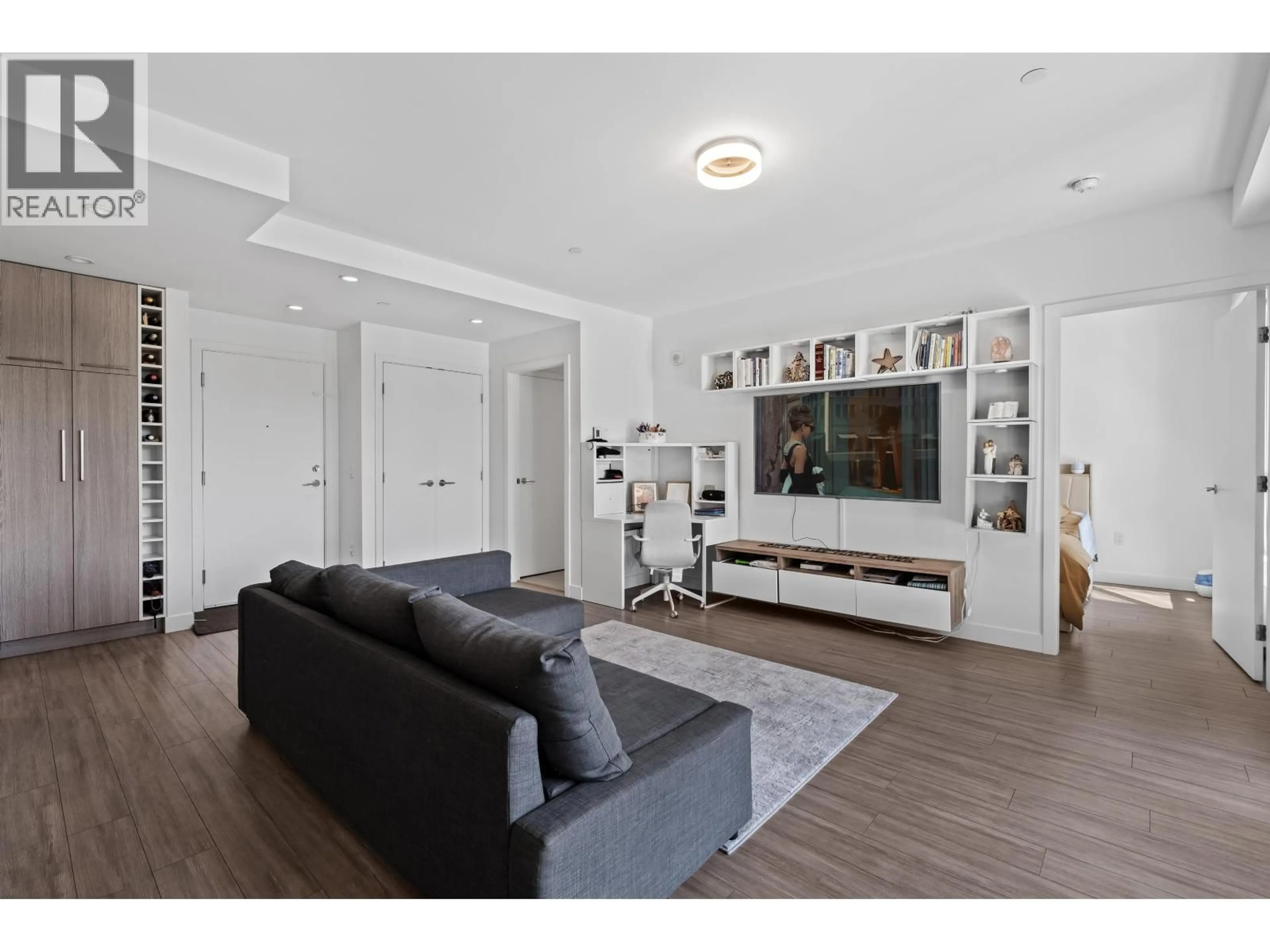 Living room with furniture, wood/laminate floor for 306 - 707 3RD STREET, North Vancouver British Columbia V7L1G8