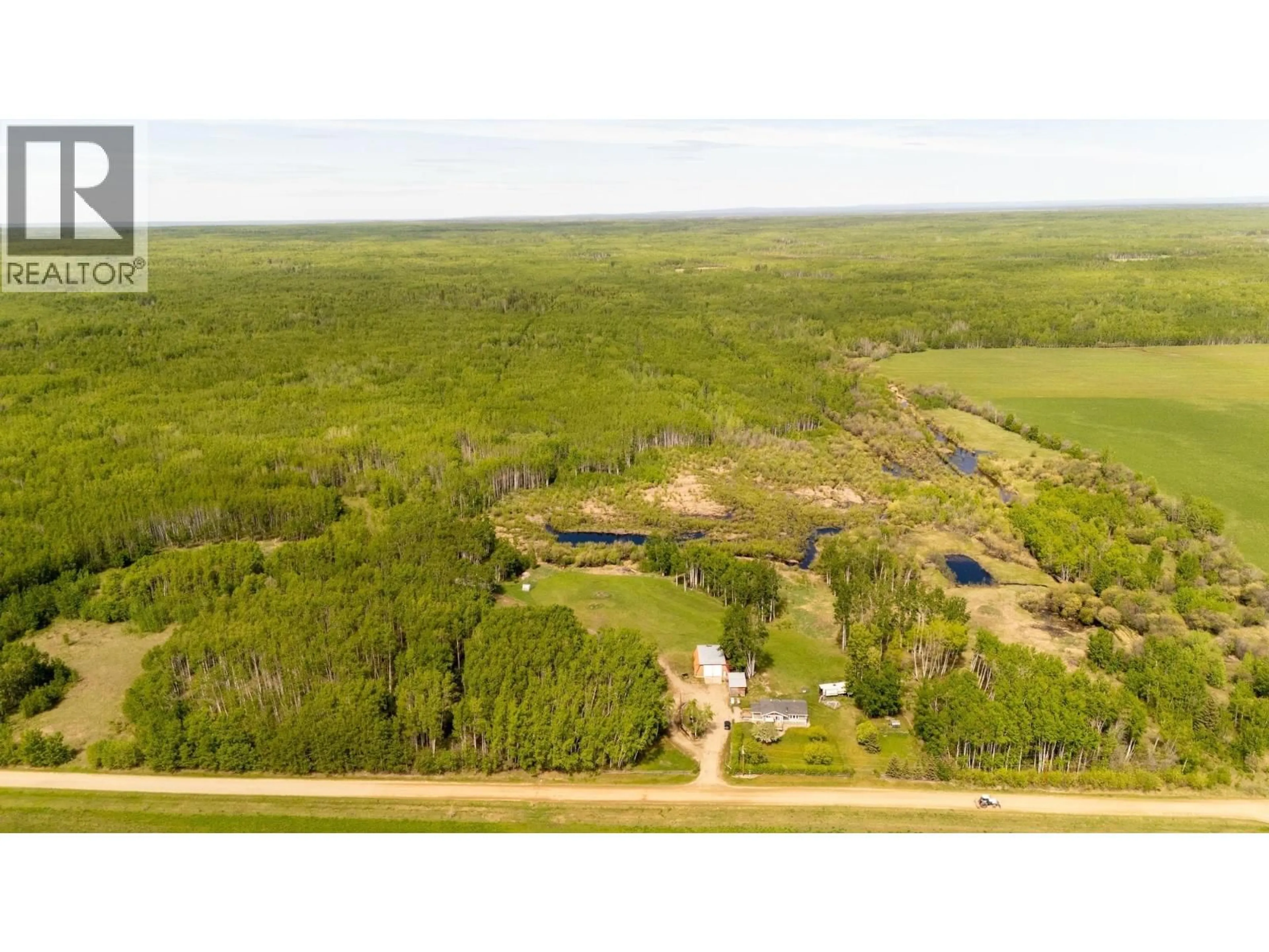 A pic from outside/outdoor area/front of a property/back of a property/a pic from drone, forest/trees view for 1016 240 ROAD, Fort St. John British Columbia V0C1K0