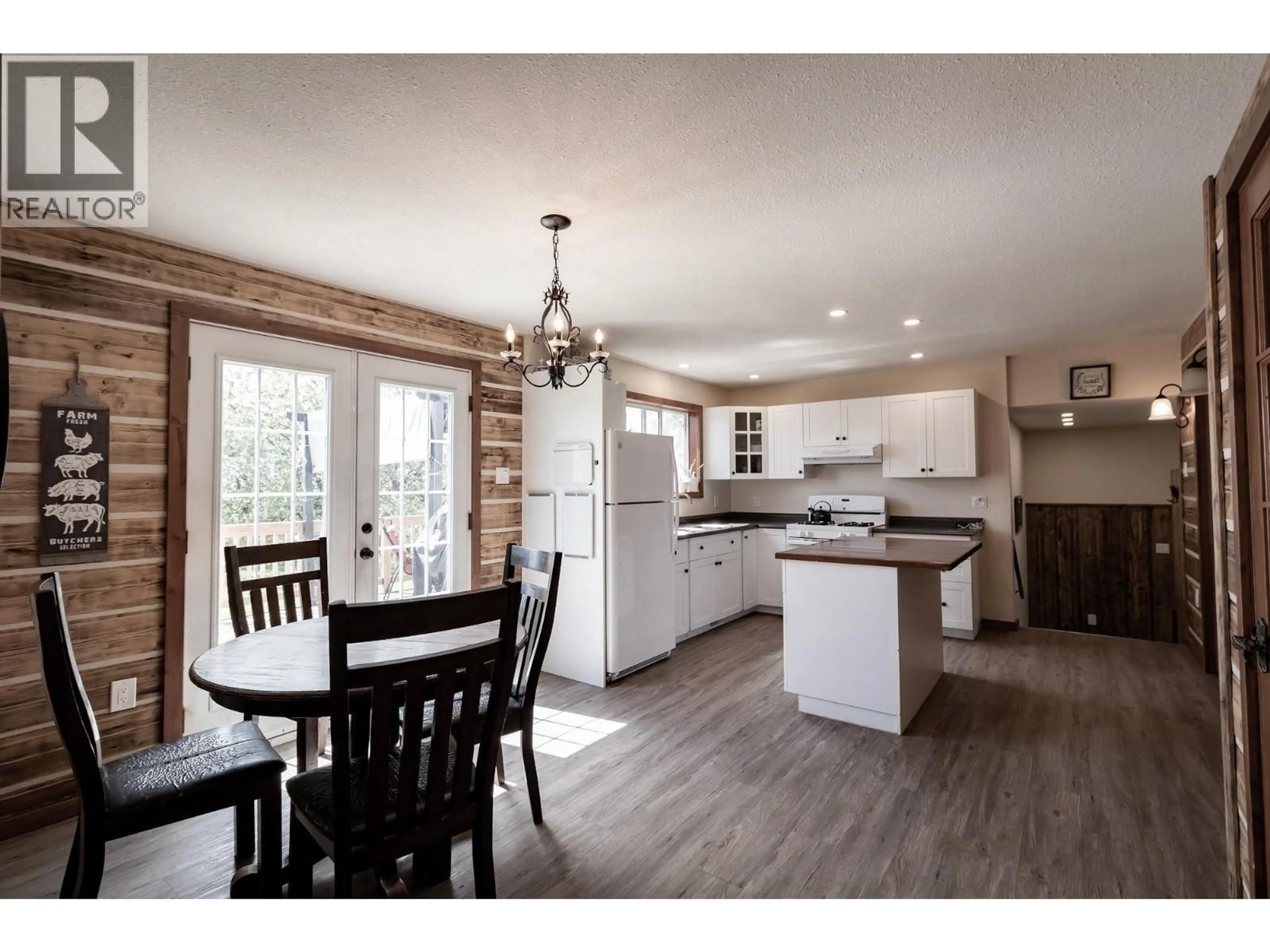 Open concept kitchen, wood/laminate floor for 1016 240 ROAD, Fort St. John British Columbia V0C1K0