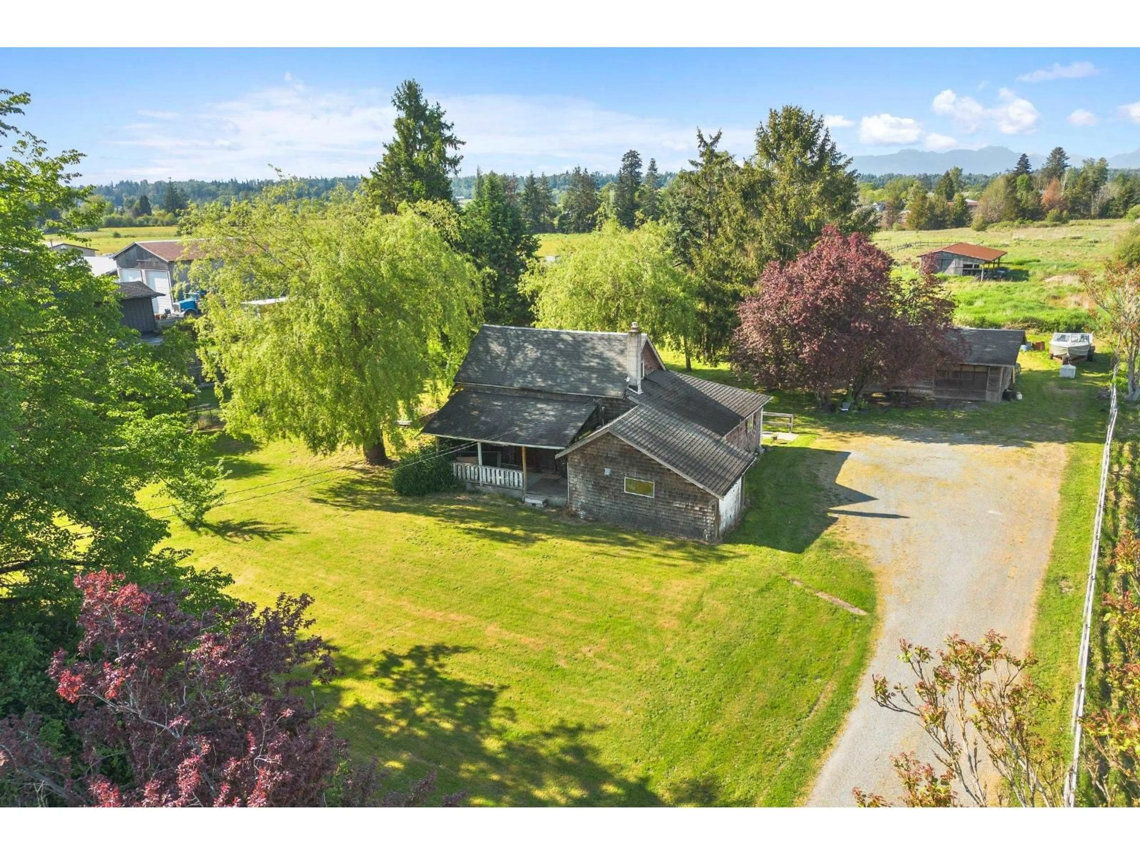 A pic from outside/outdoor area/front of a property/back of a property/a pic from drone, water/lake/river/ocean view for 21947 61 AVENUE, Langley British Columbia V2Y2P2